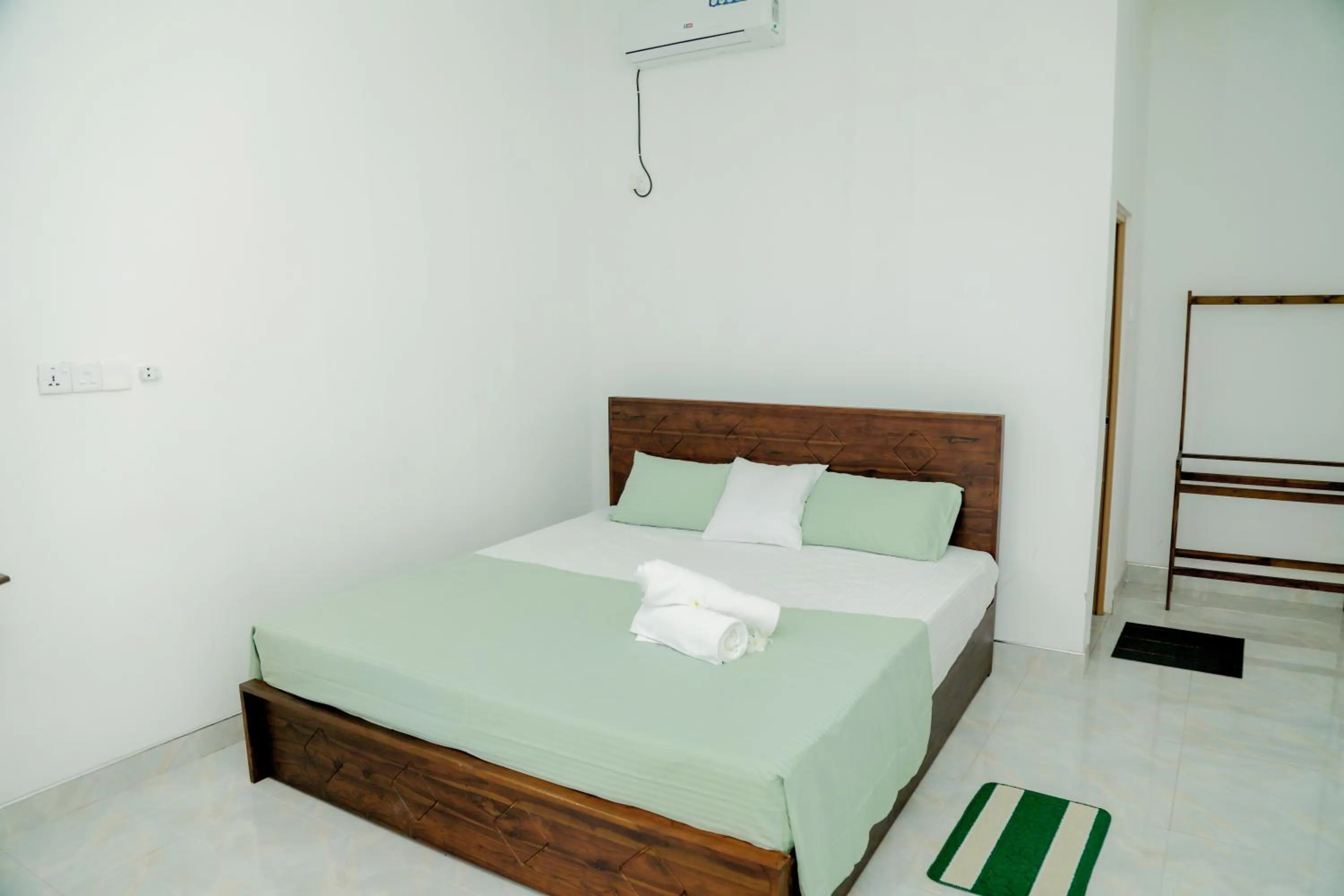 Bed in Araliya Lagoon Park Resort