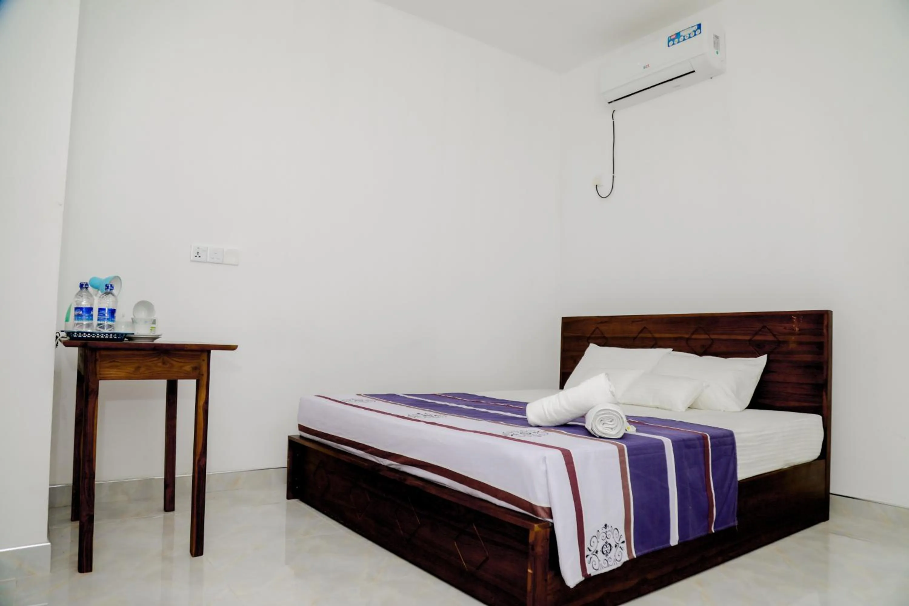 Bed in Araliya Lagoon Park Resort