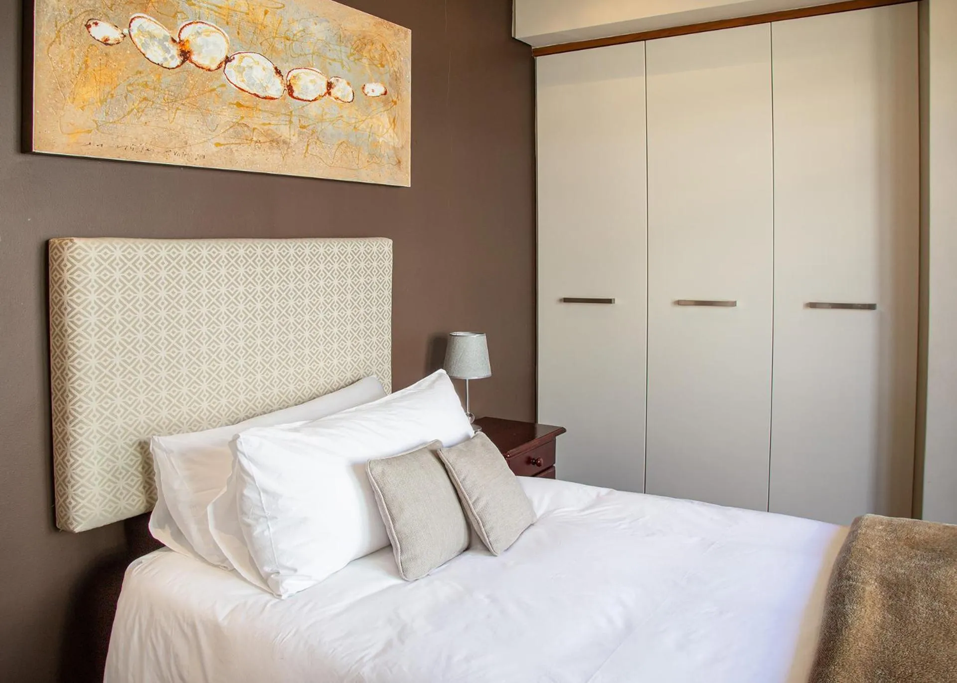 Bed in Marine Square Luxury Suites