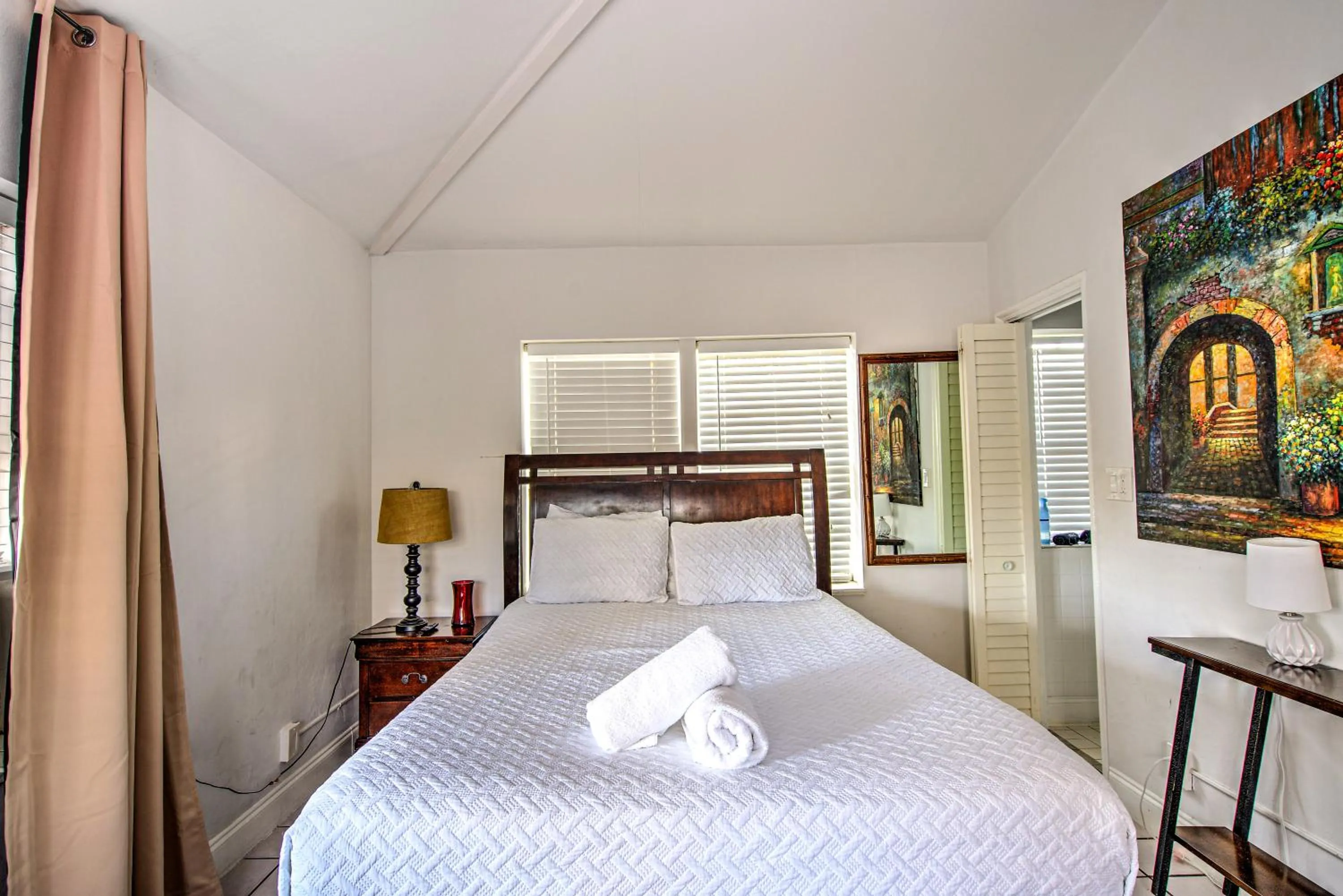 Bed in Little Paris by the ocean self check in