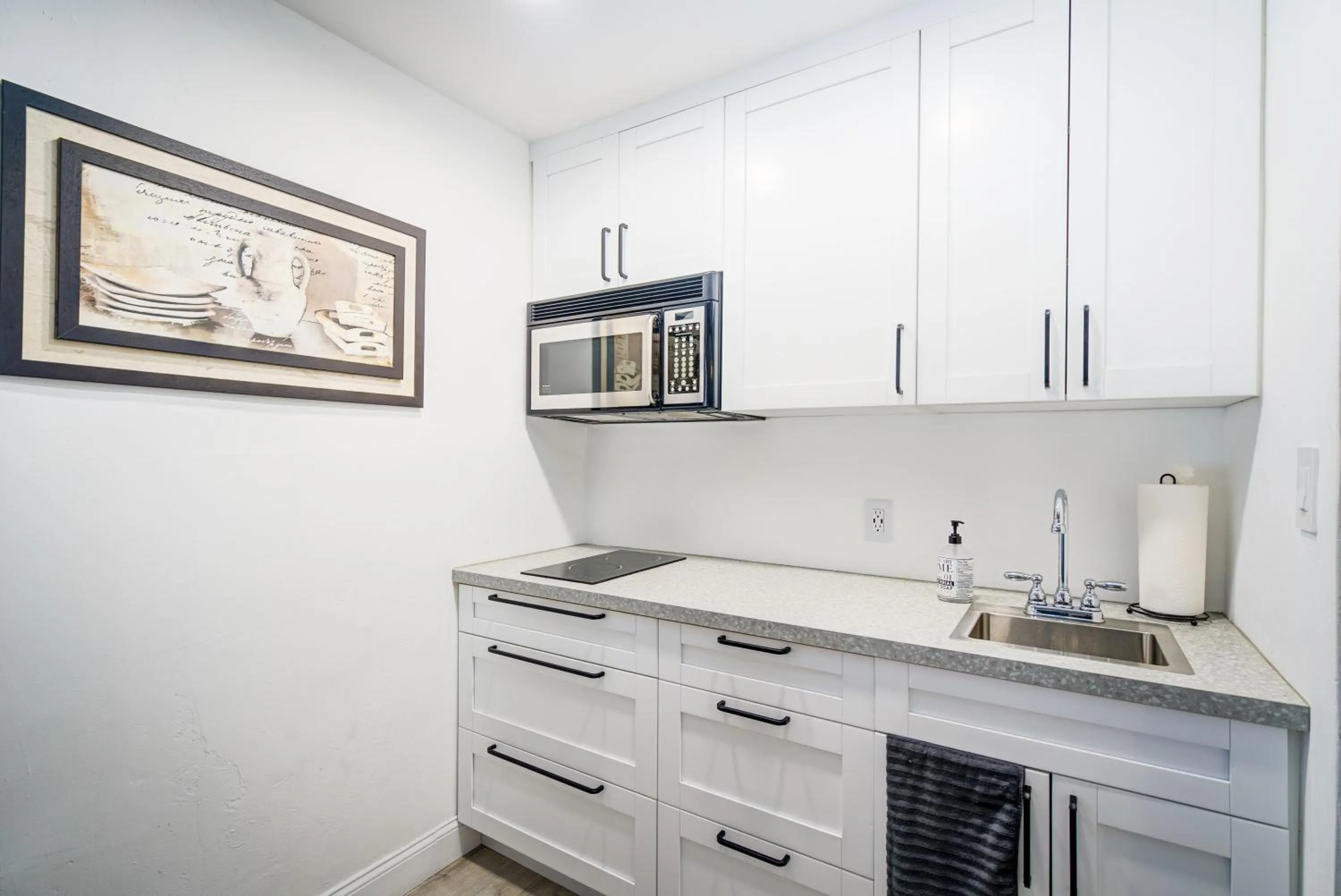 Kitchen or kitchenette in Little Paris by the ocean self check in