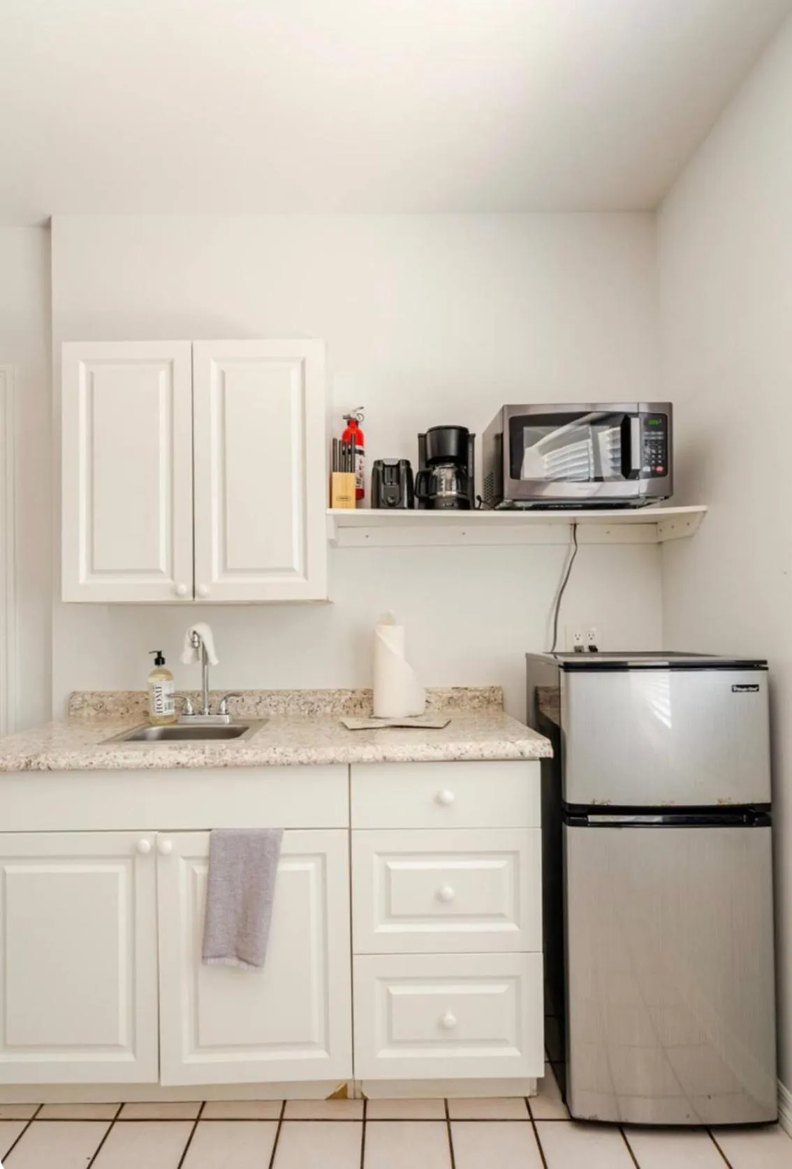 Kitchen or kitchenette in Little Paris by the ocean self check in