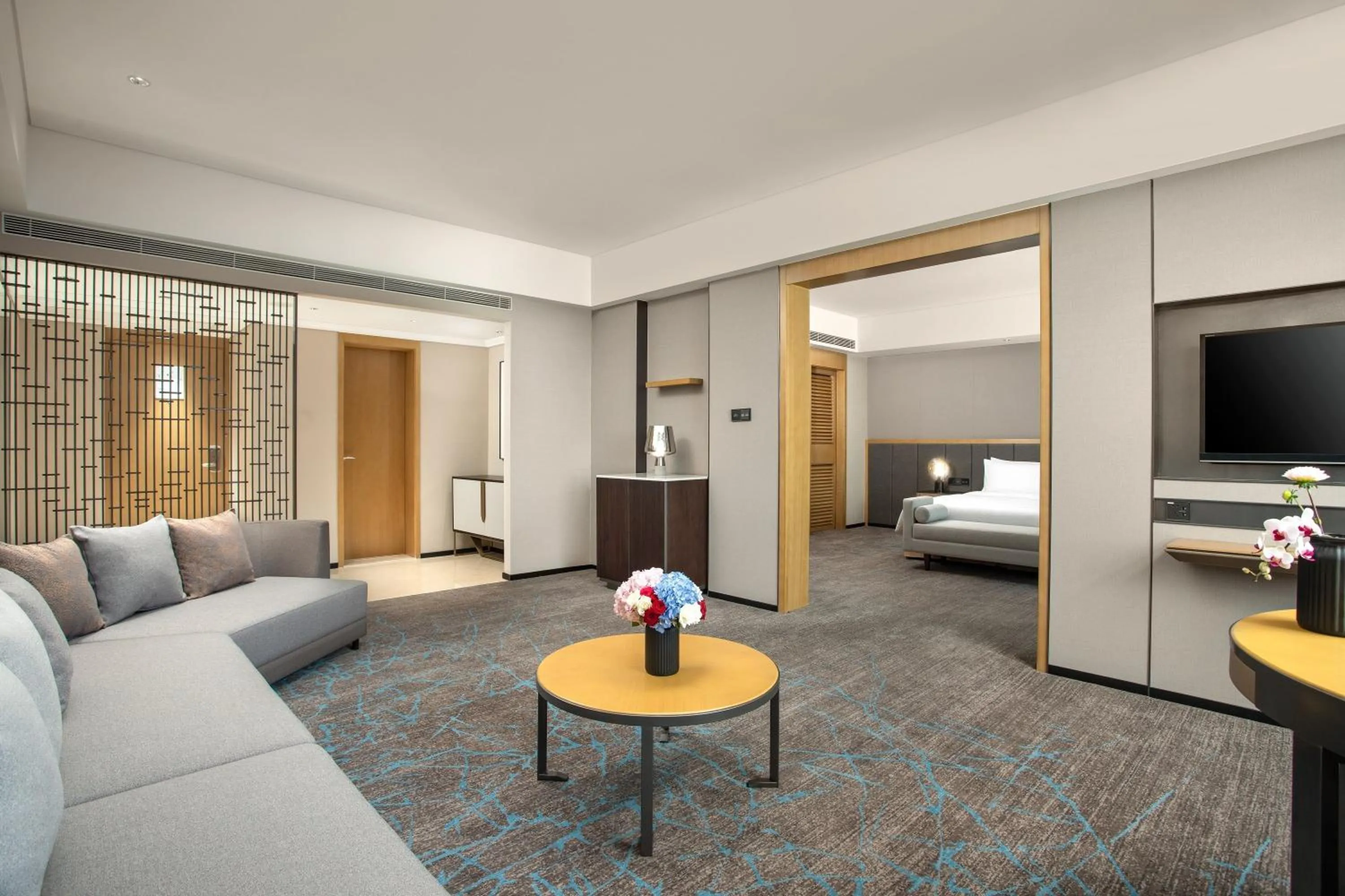 Living room, Bed in Crowne Plaza Shanghai Fudan by IHG
