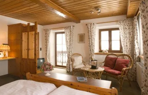 Seating area, Bed in Landhotel Binderhäusl Garni