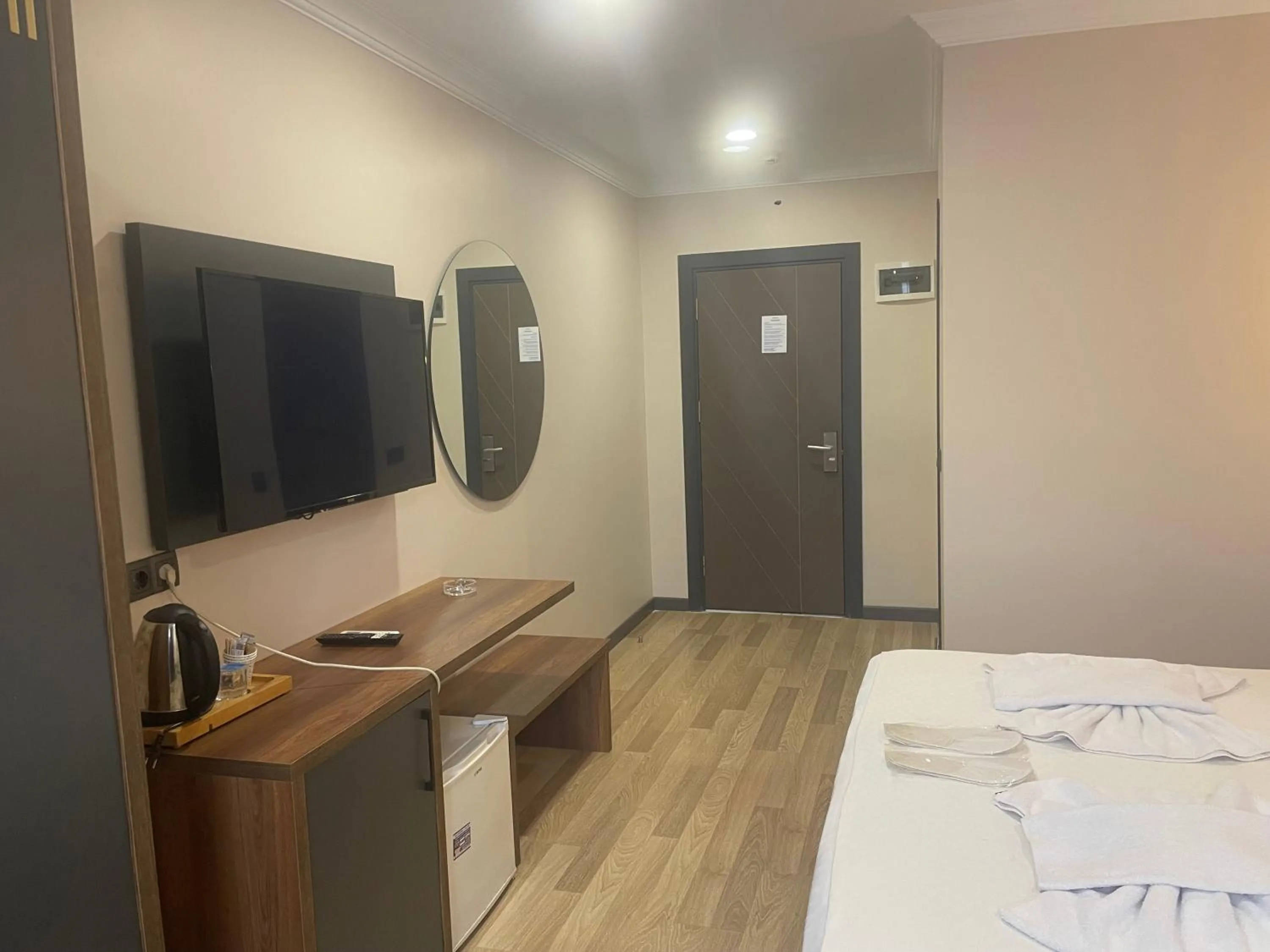 Communal lounge/ TV room, Bed in La Vie Suite Hotel