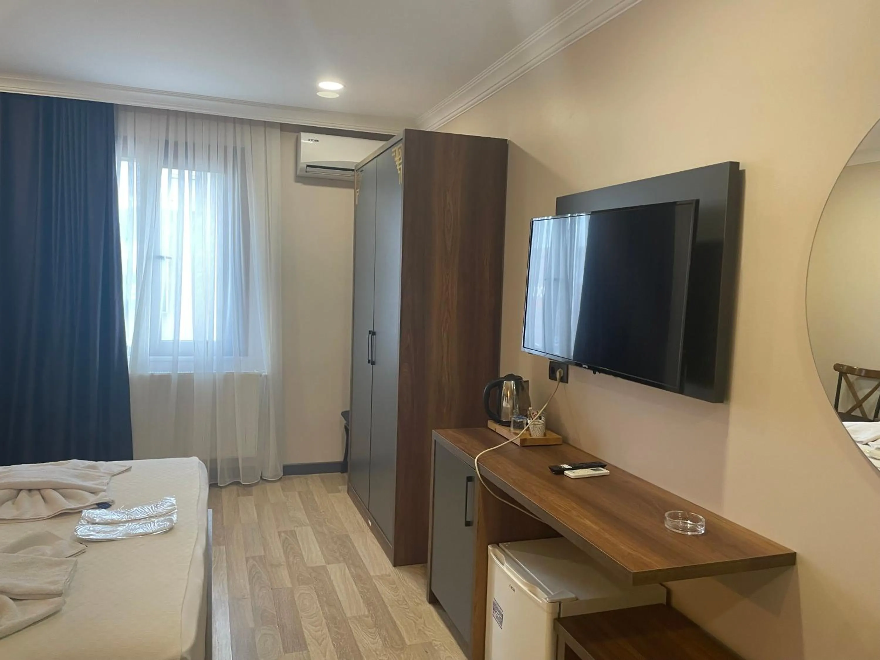 Communal lounge/ TV room, Bed in La Vie Suite Hotel