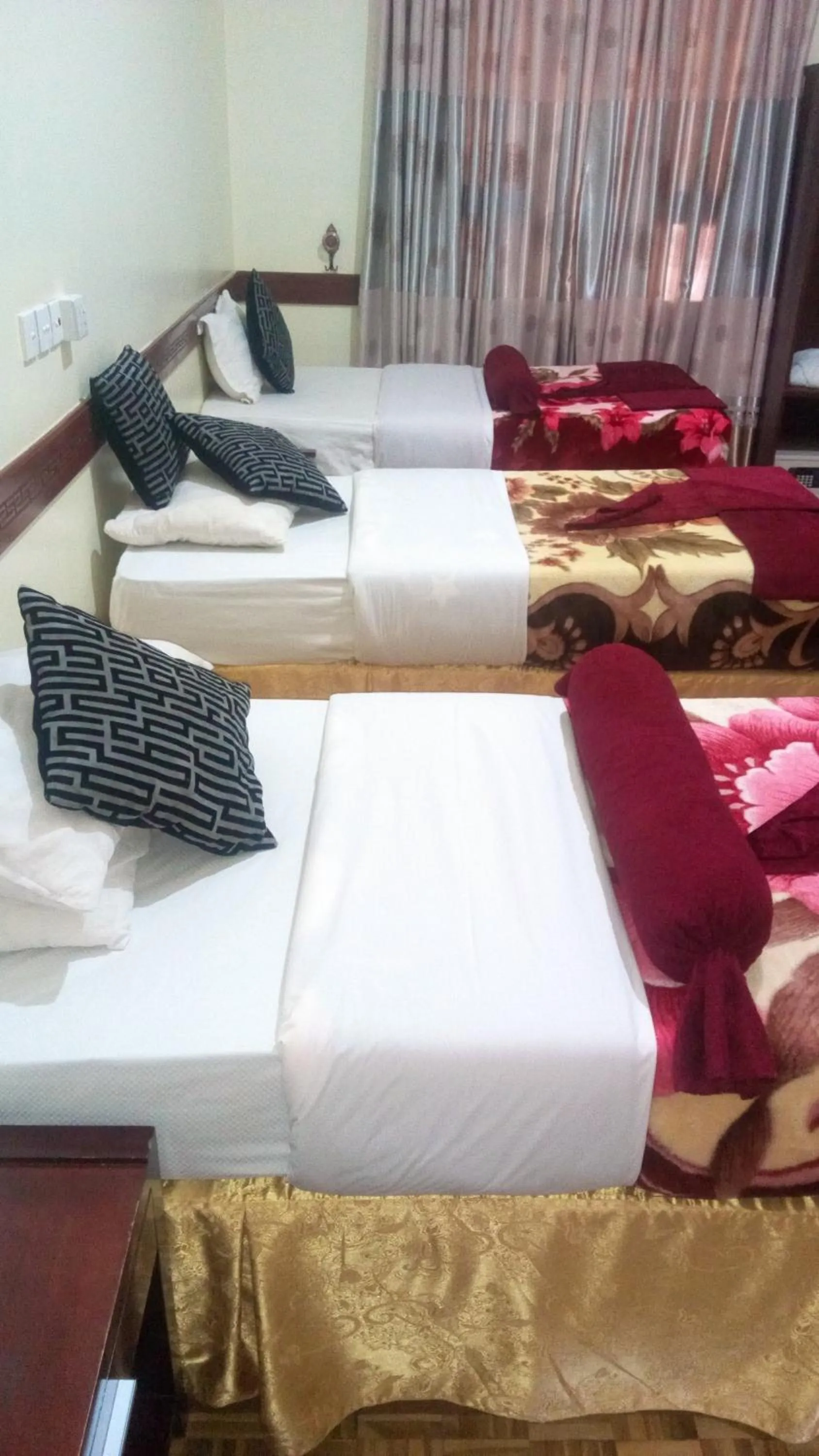 Bed in New Charity Hotel International