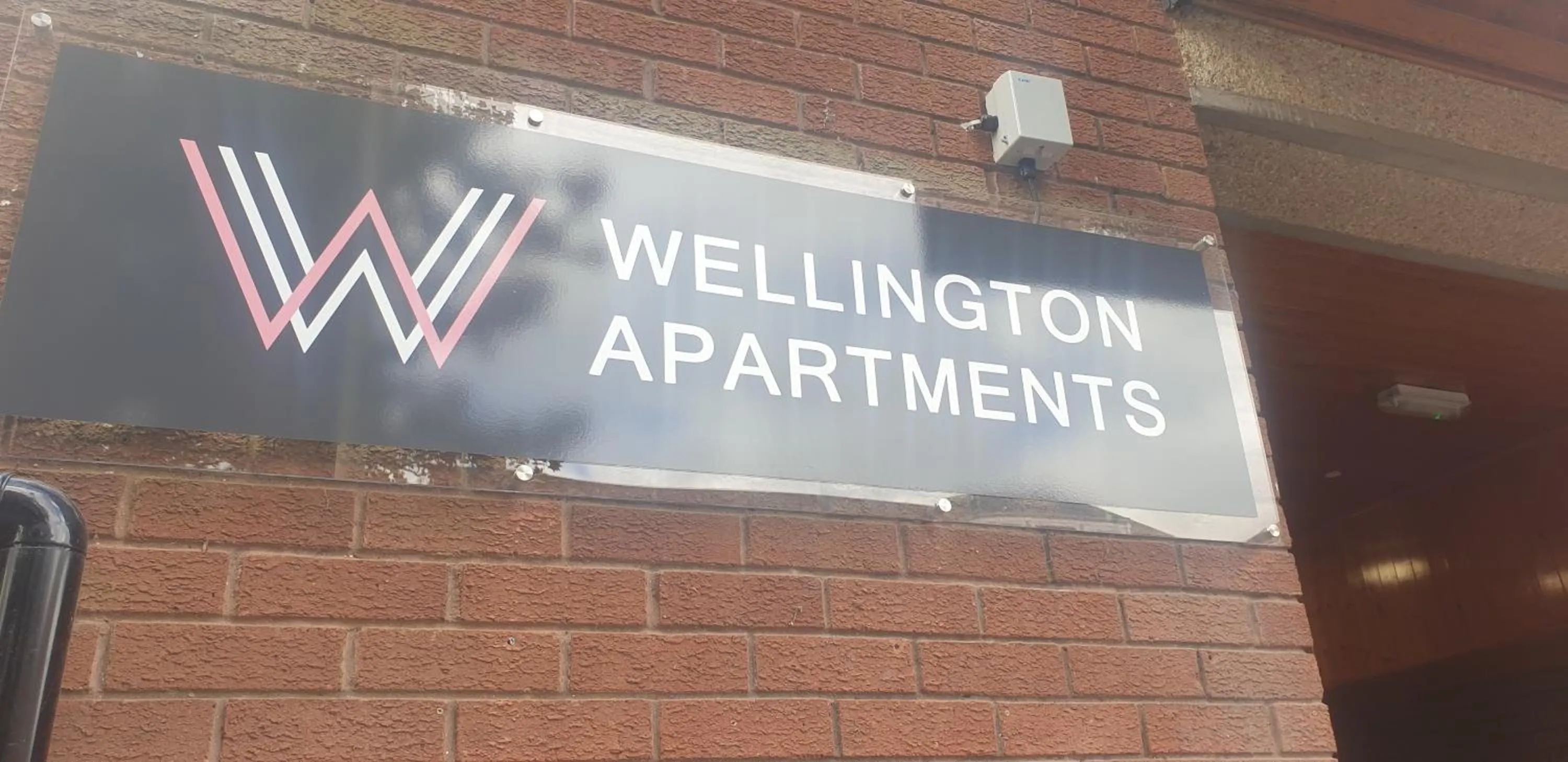 Property logo or sign in Wellington Apartments