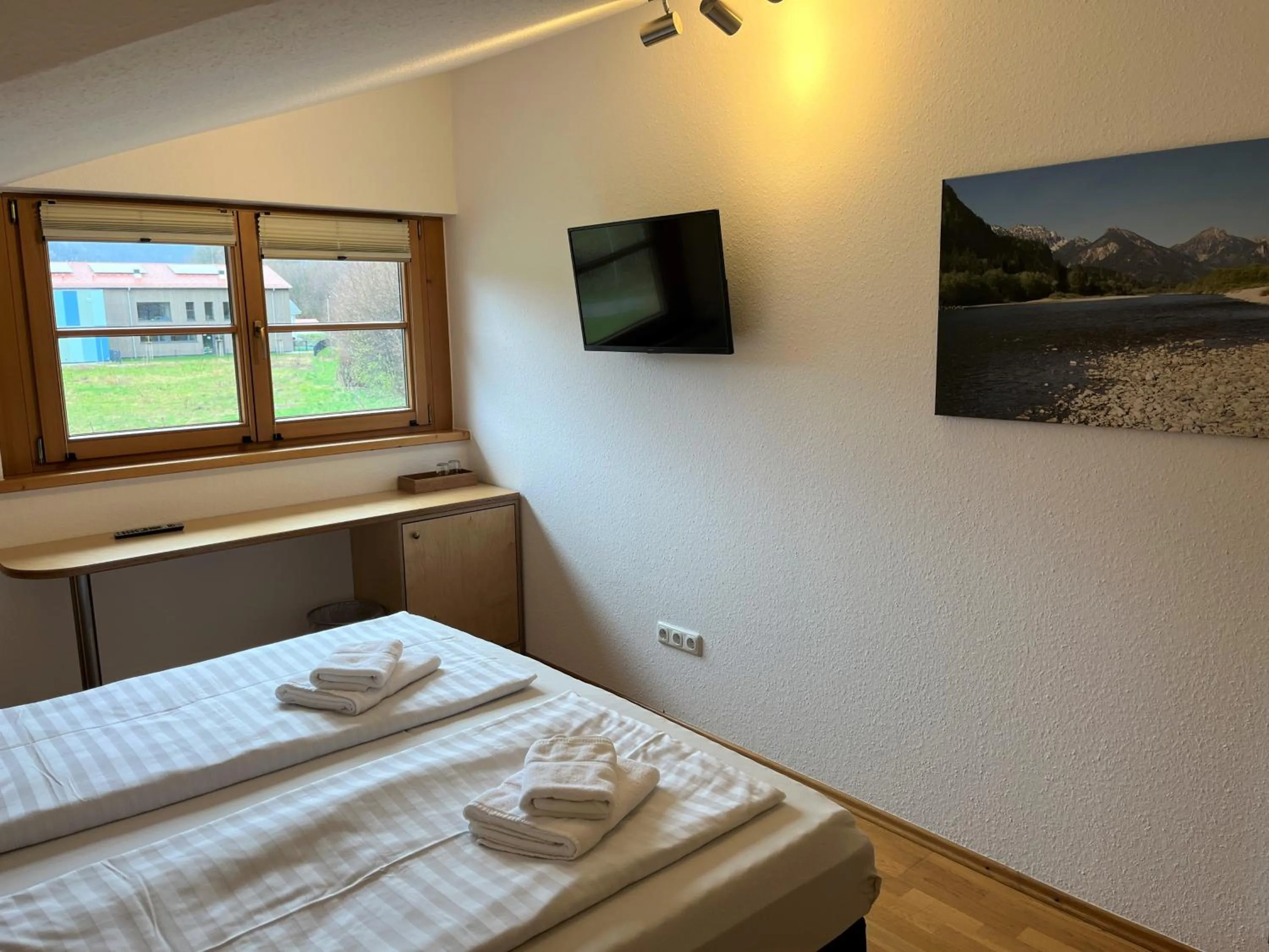 Photo of the whole room, Bed in Gästehaus Forggensee