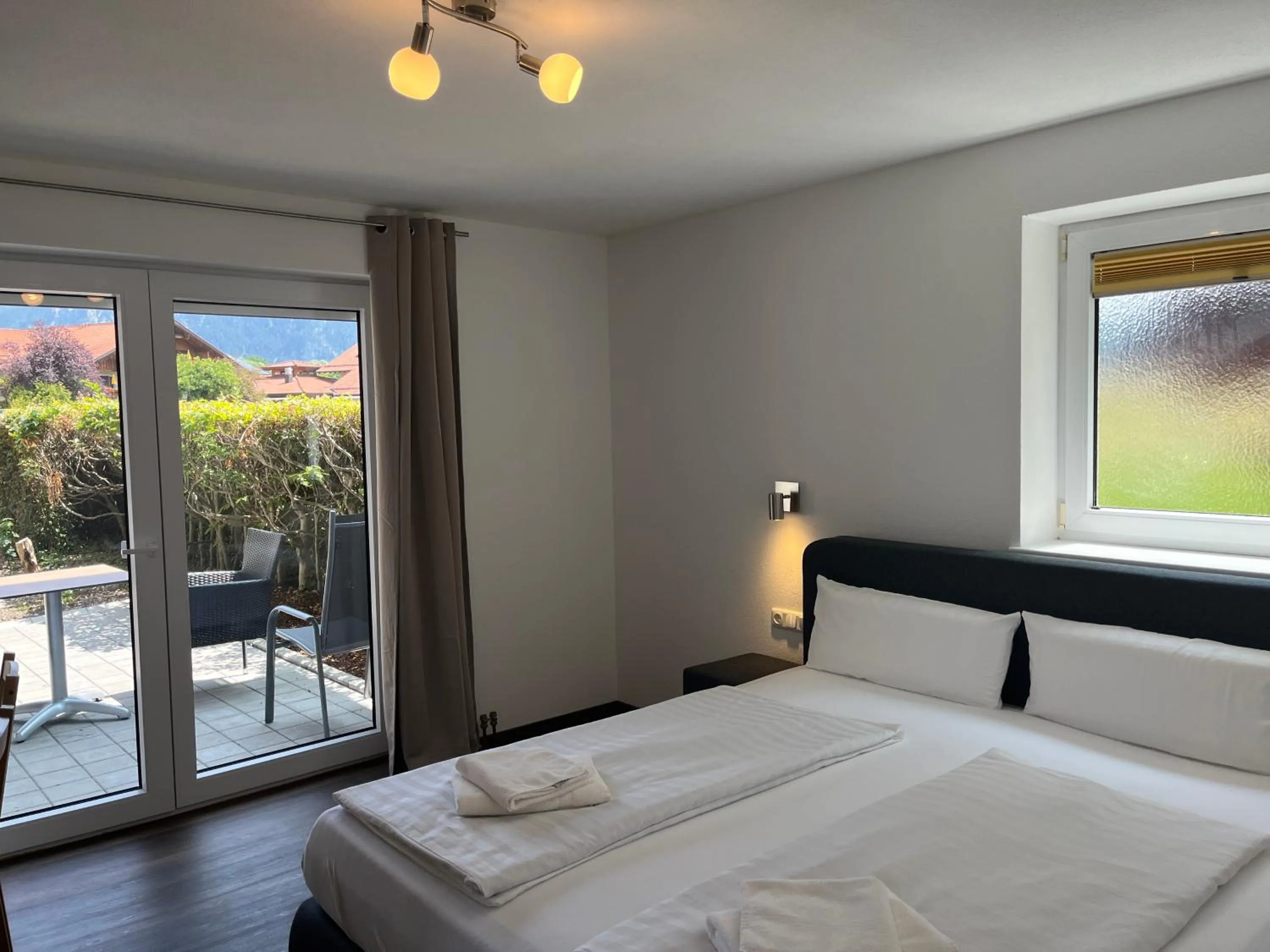 Photo of the whole room, Bed in Gästehaus Forggensee