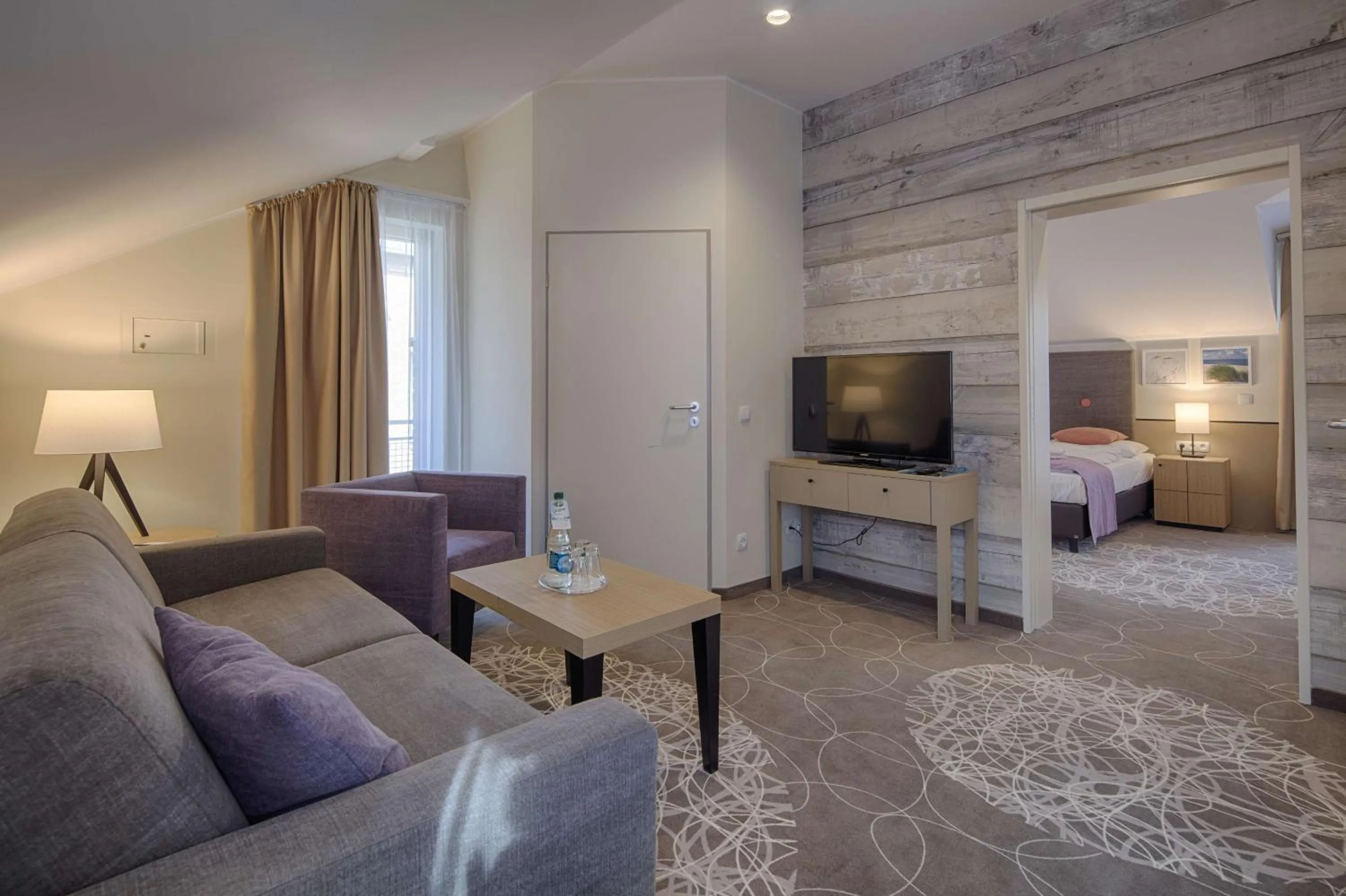 Living room, Bed in Aquamaris Strandresidenz Rügen