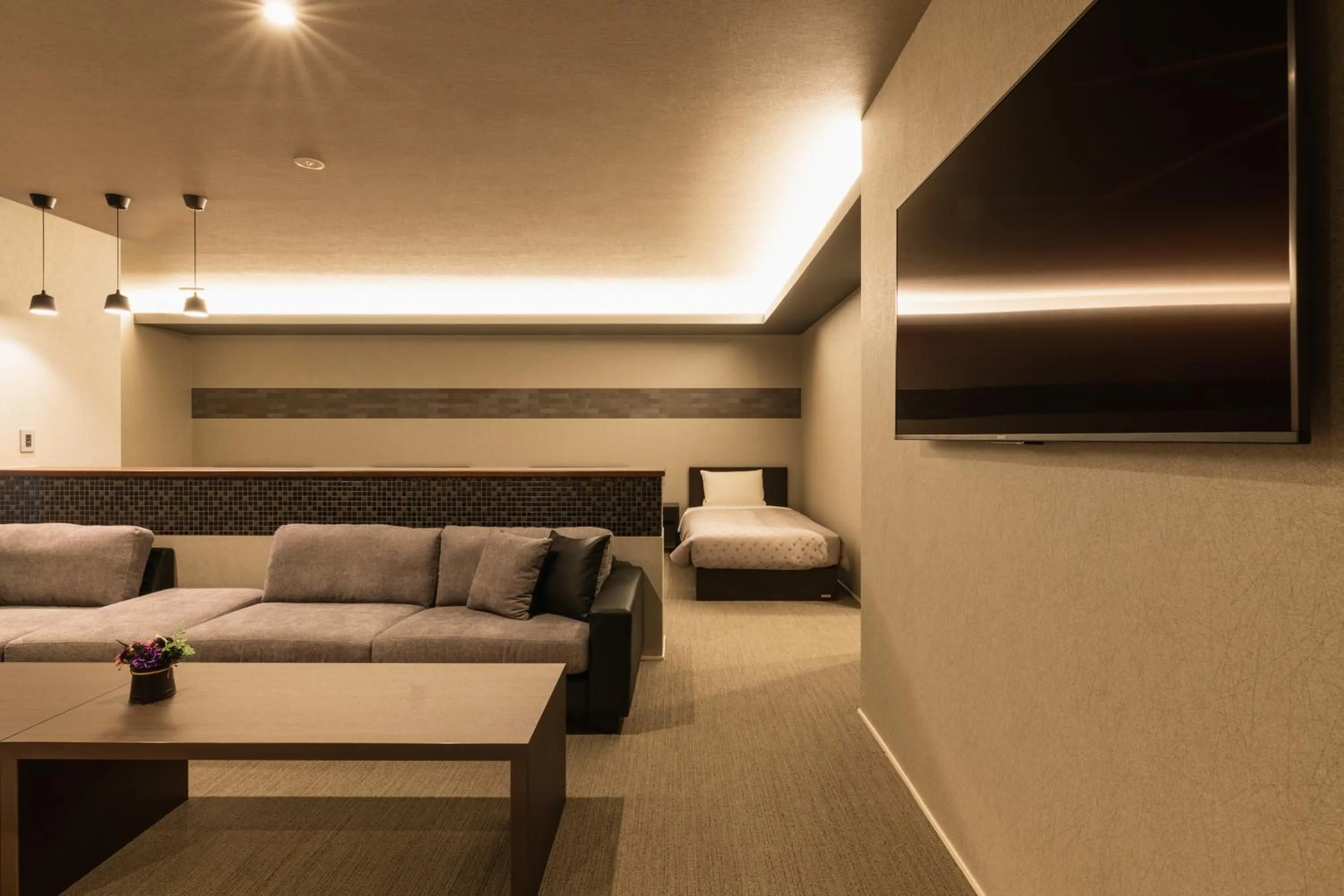 Seating area, Bed in GRAND BASE Hakata Station