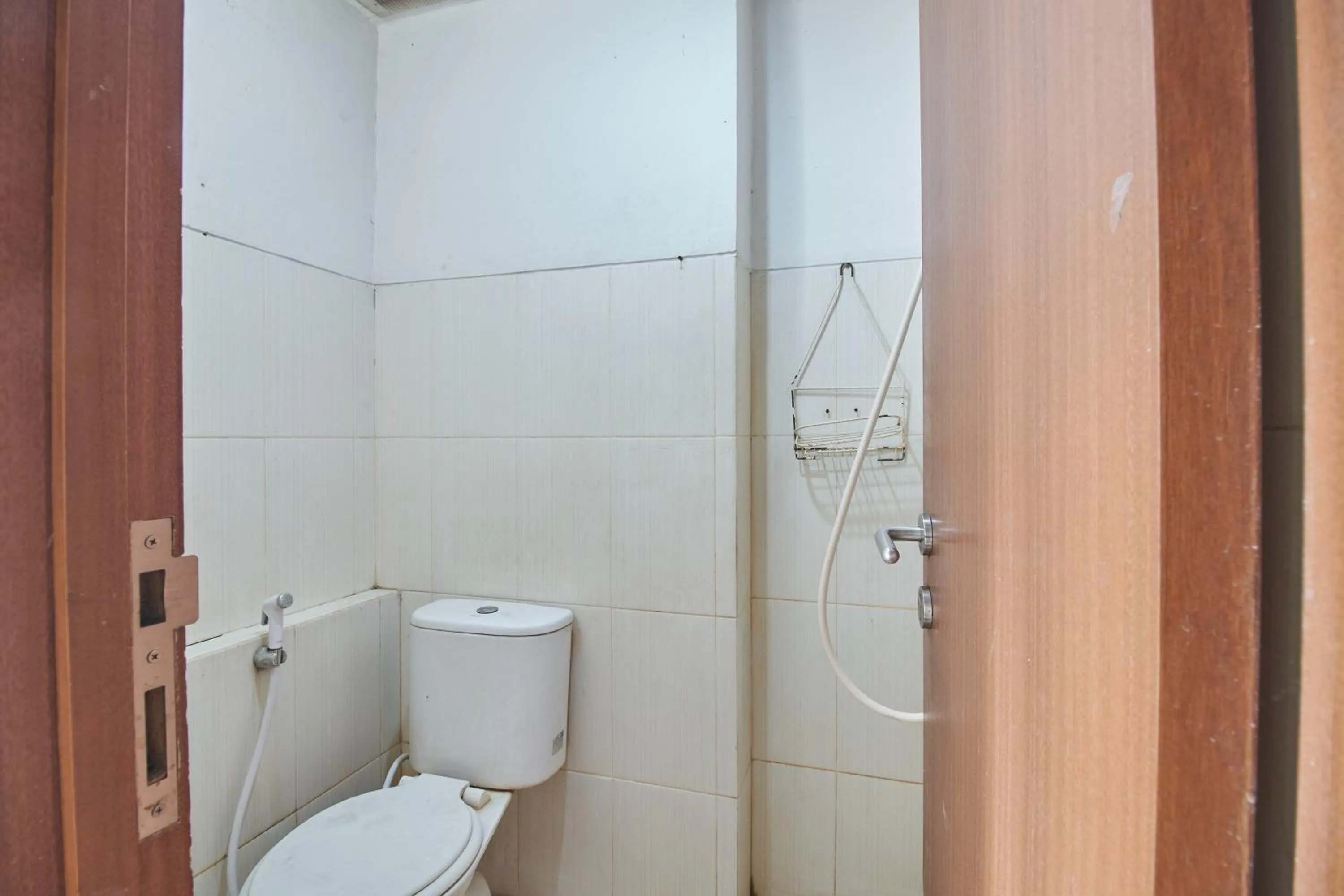 Bathroom in Apartment Green Lake View Ciputat by Celebrity Room