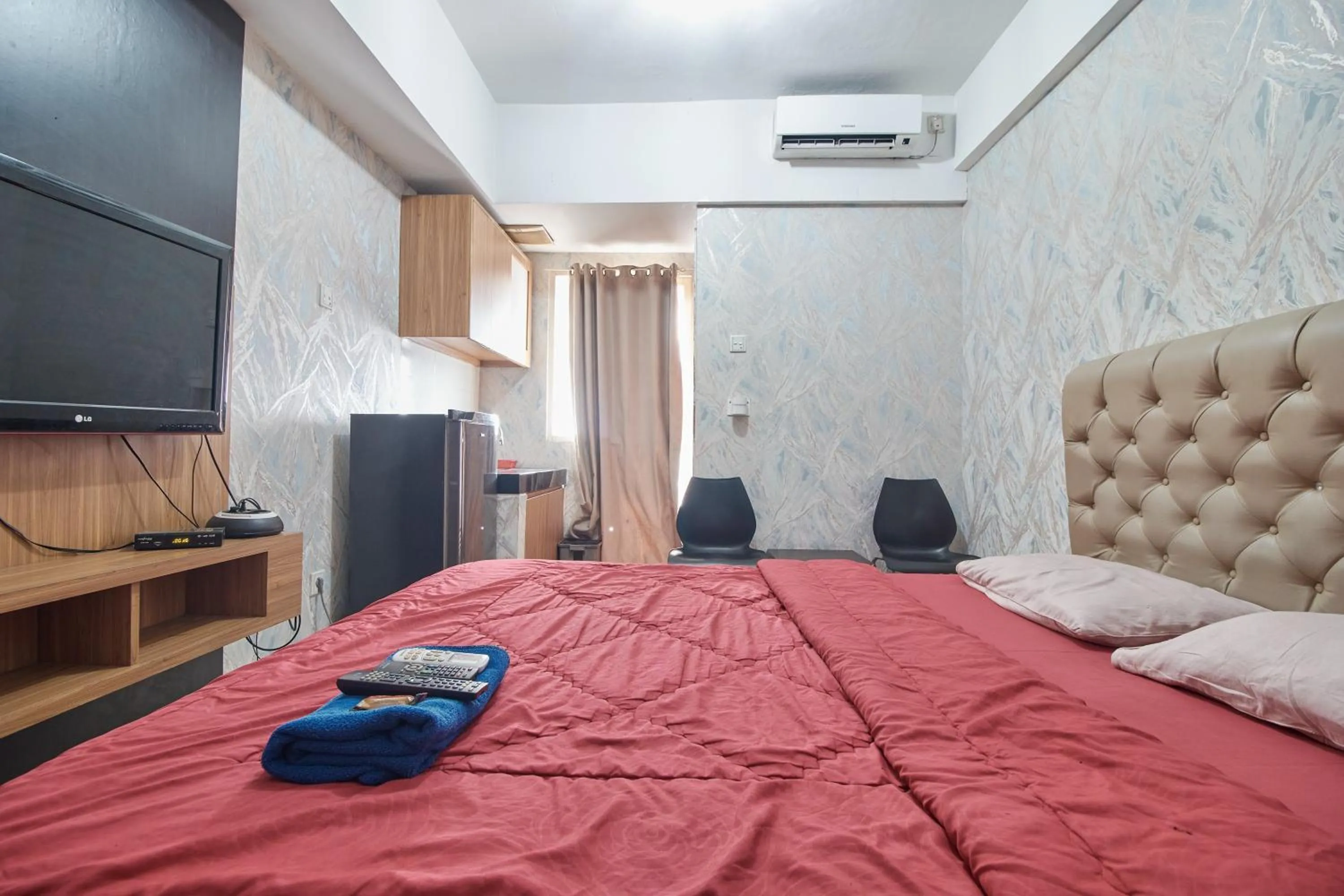 Bed in Apartment Green Lake View Ciputat by Celebrity Room