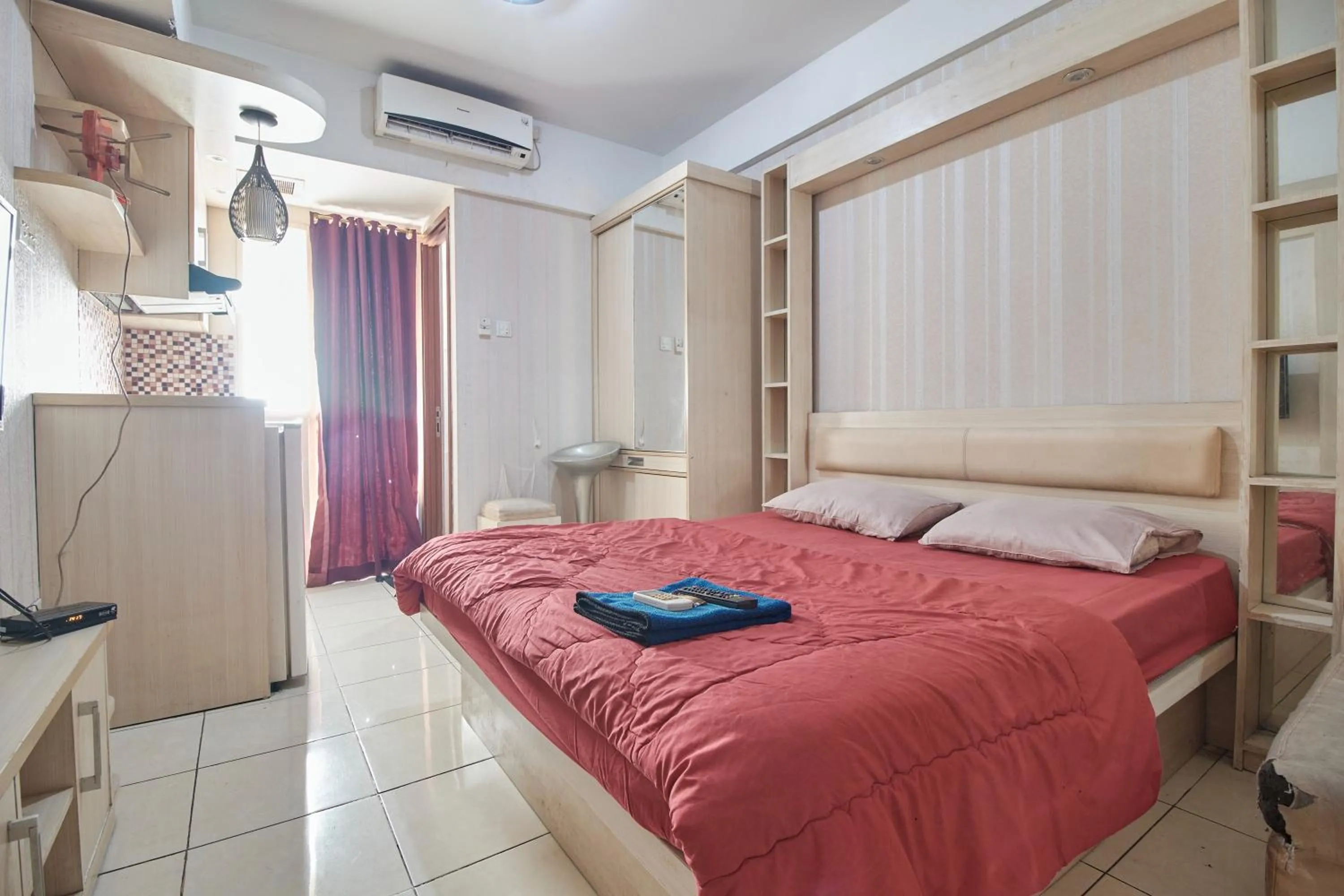 Bed in Apartment Green Lake View Ciputat by Celebrity Room