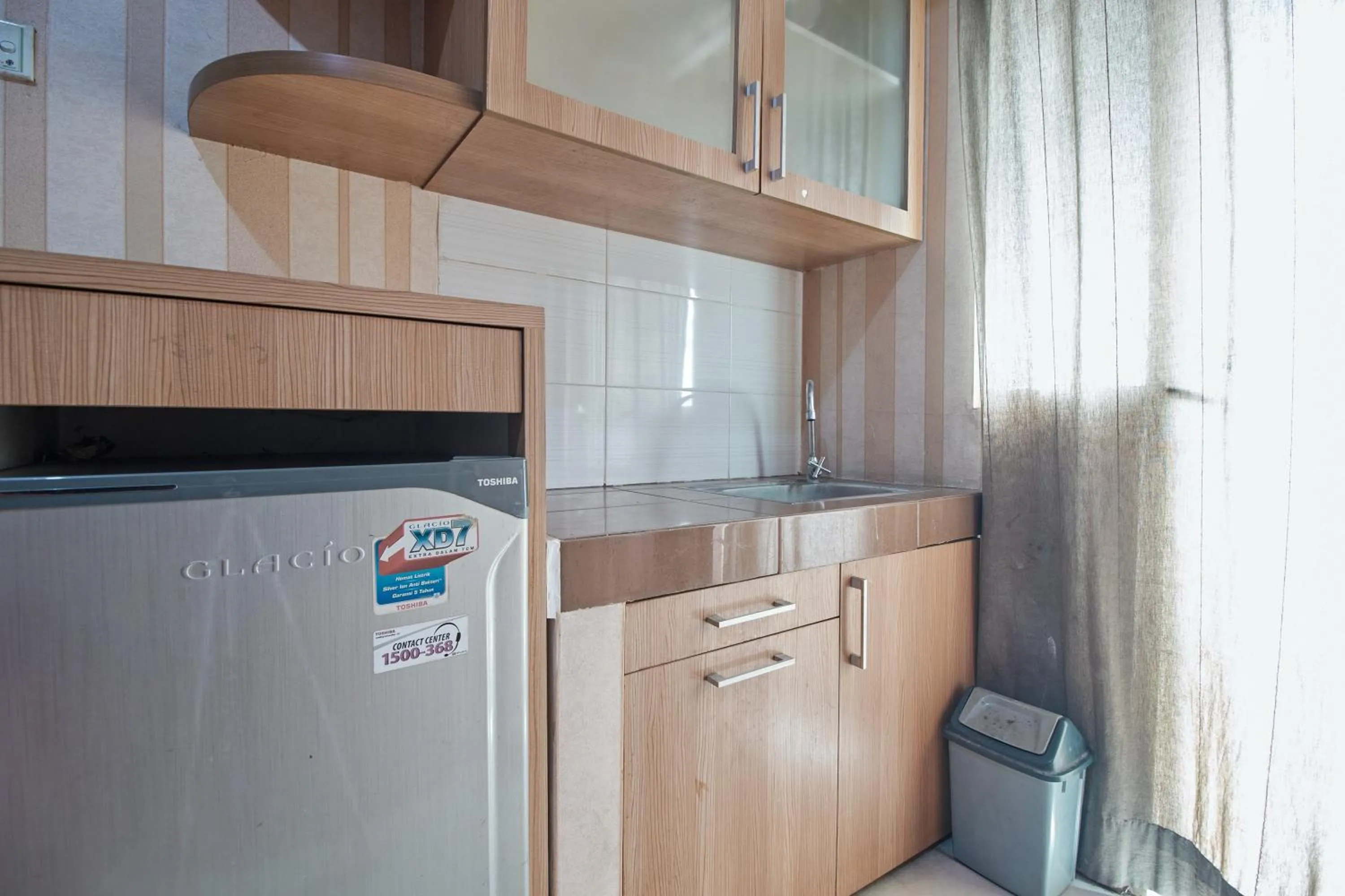 Kitchen or kitchenette in Apartment Green Lake View Ciputat by Celebrity Room