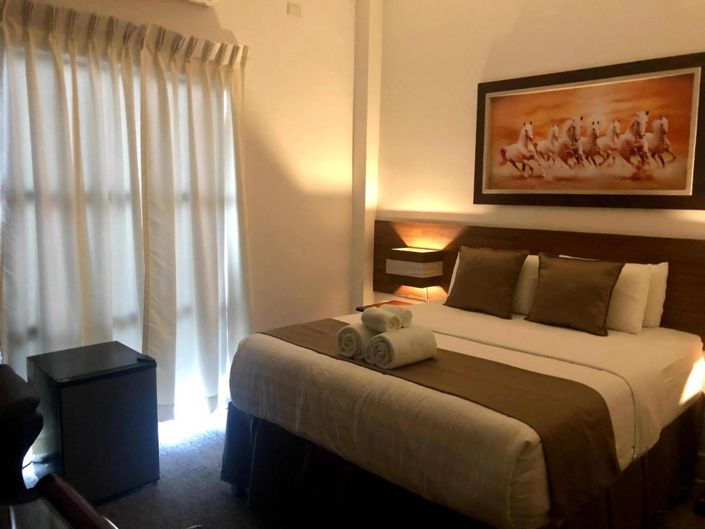 Bed in Seacliff Suites Hotel and Resort