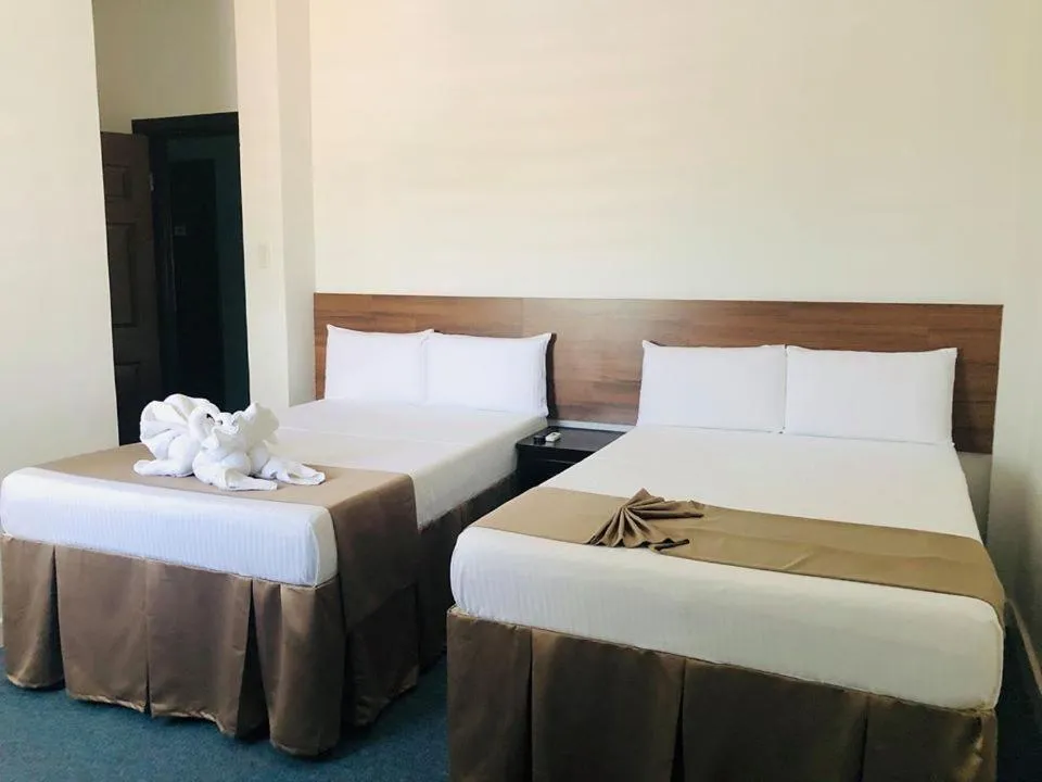 Bed in Seacliff Suites Hotel and Resort