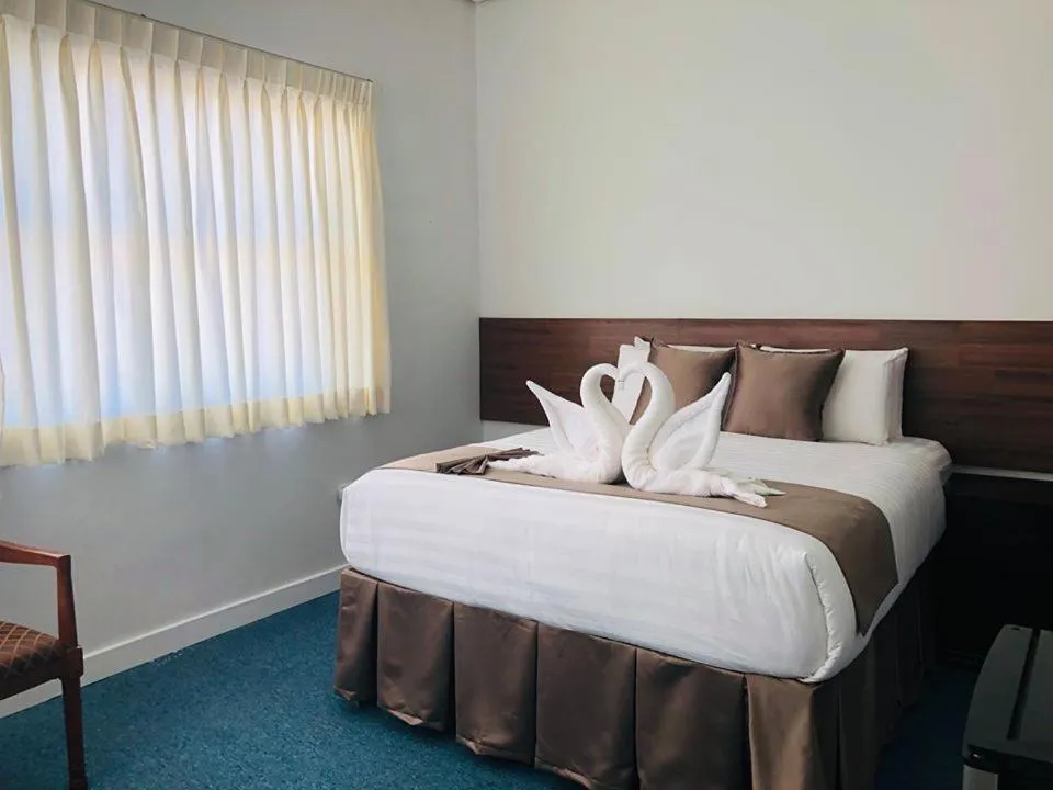 Bed in Seacliff Suites Hotel and Resort