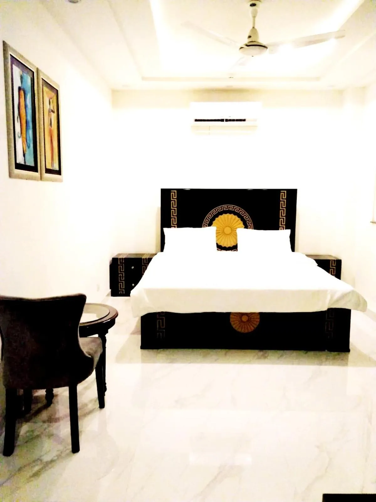 Bedroom, Bed in Jade Dragon Hotel DHA Lahore