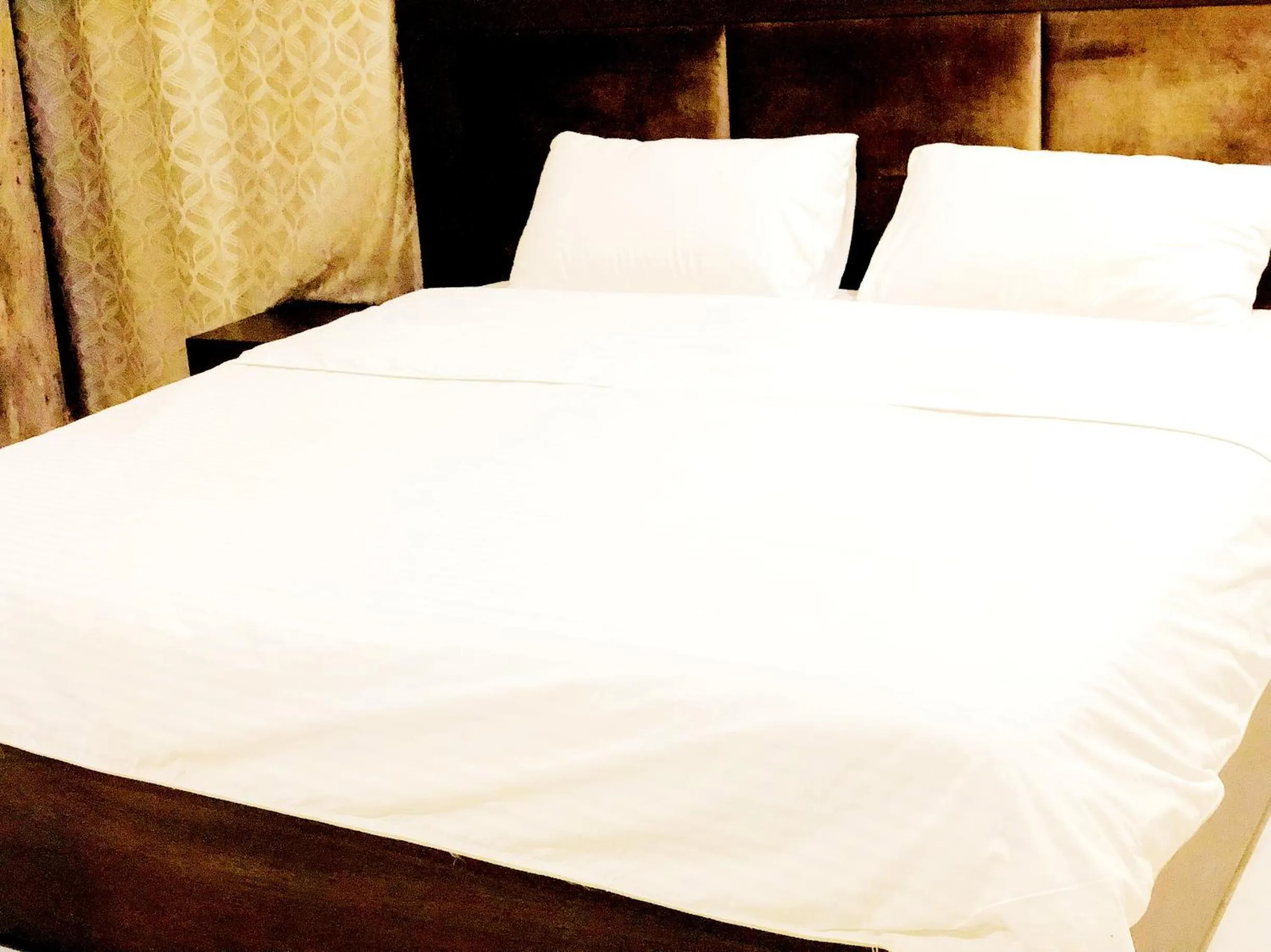 Bed in Jade Dragon Hotel DHA Lahore