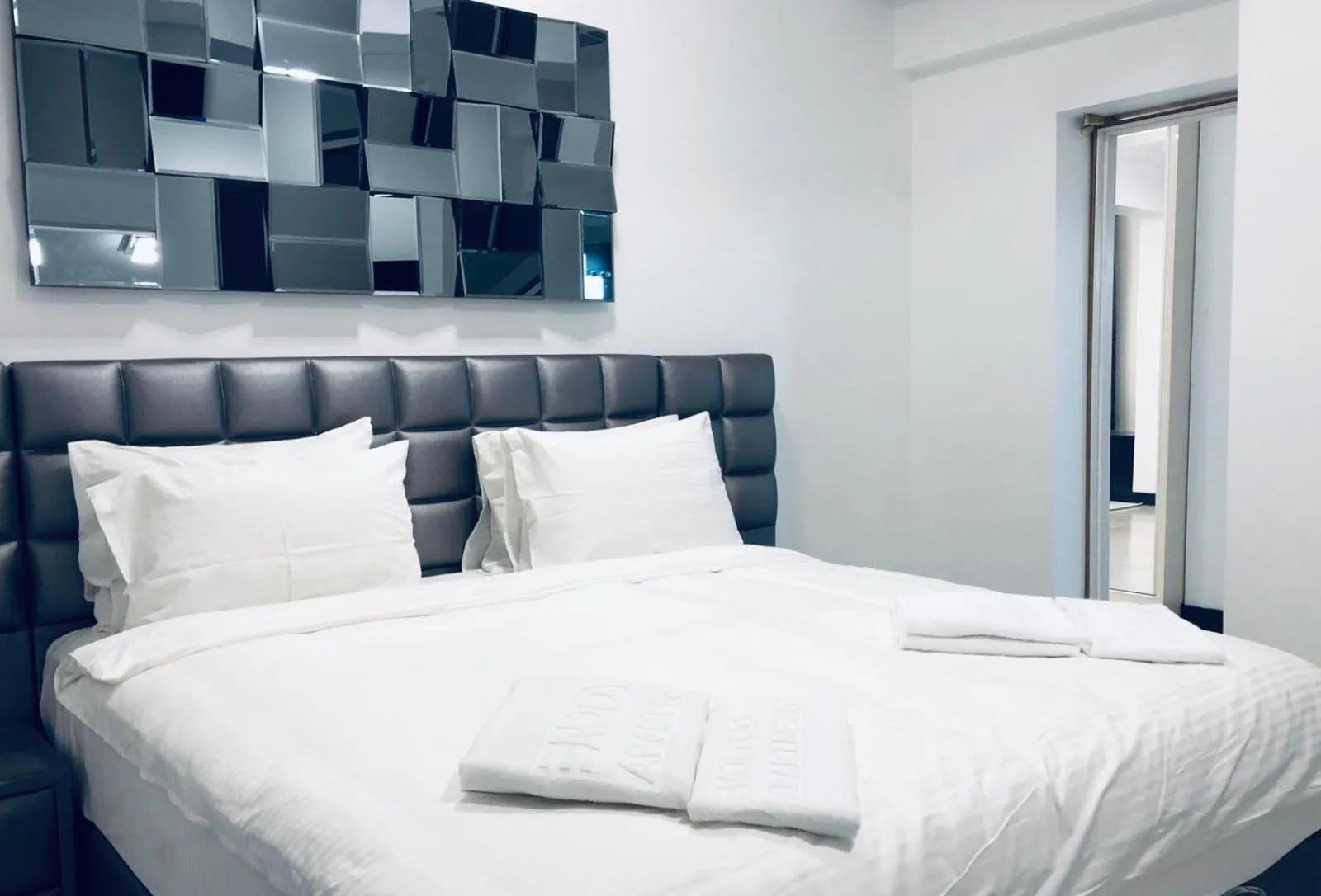 Bed in Enjoy Life Apartments