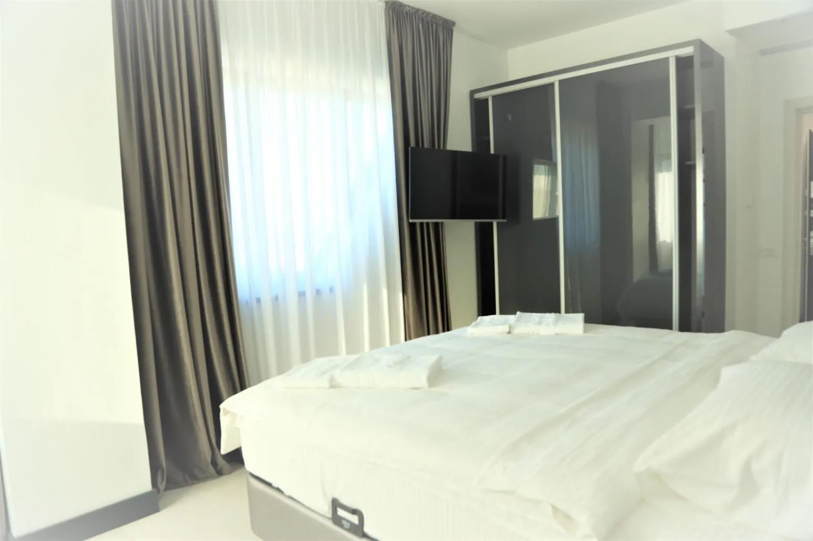 Bed in Enjoy Life Apartments