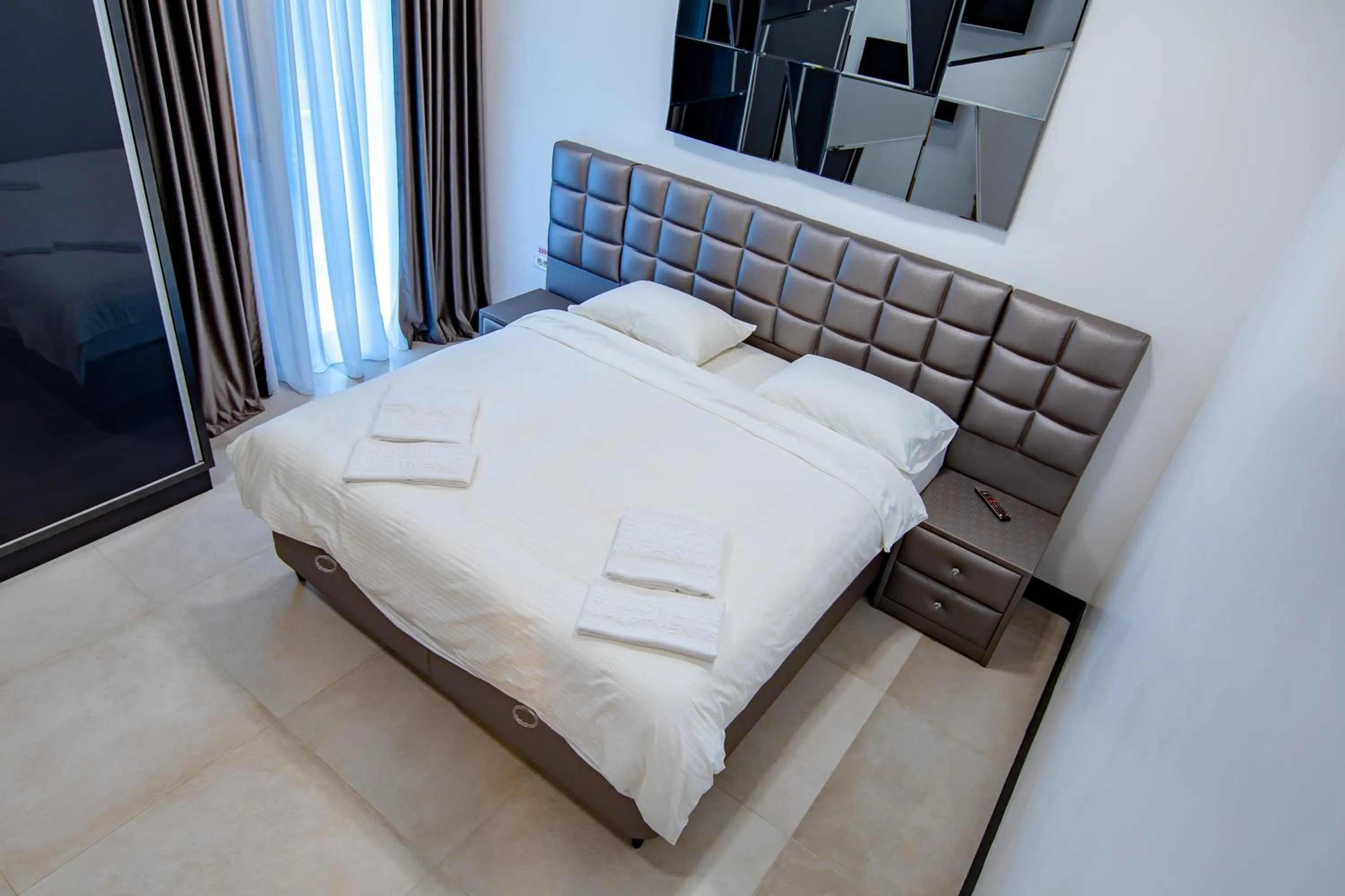 Bed in Enjoy Life Apartments