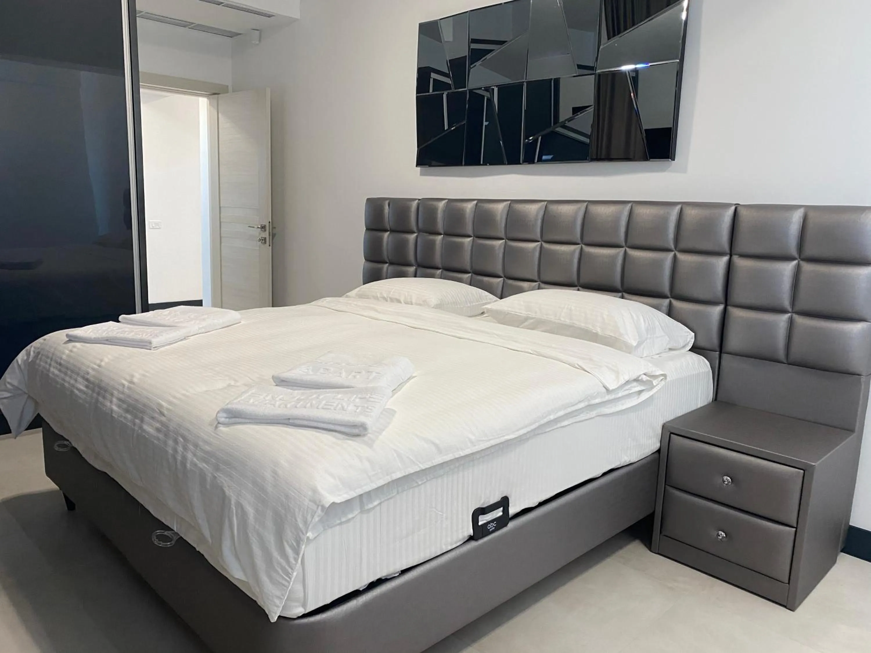 Bed in Enjoy Life Apartments