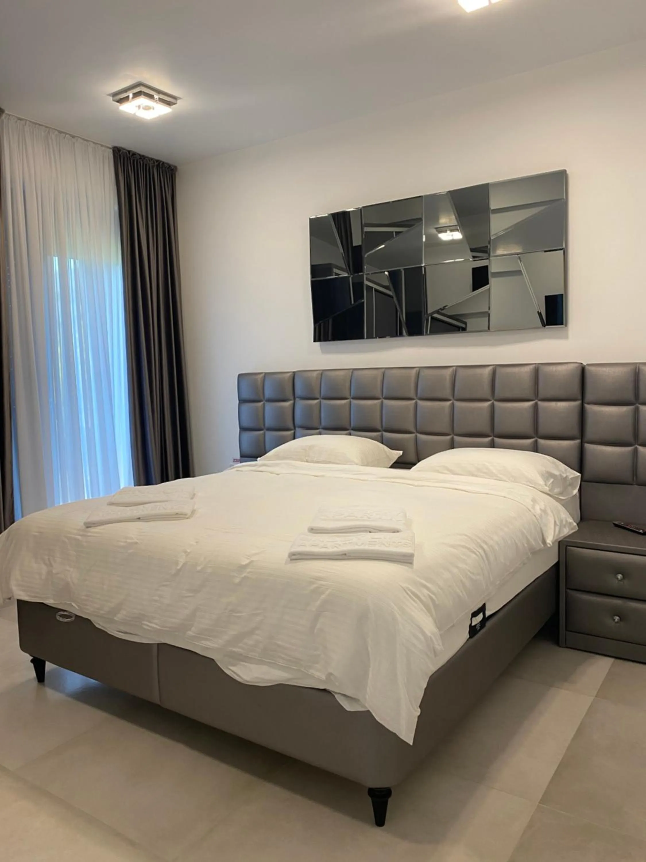 Bed in Enjoy Life Apartments