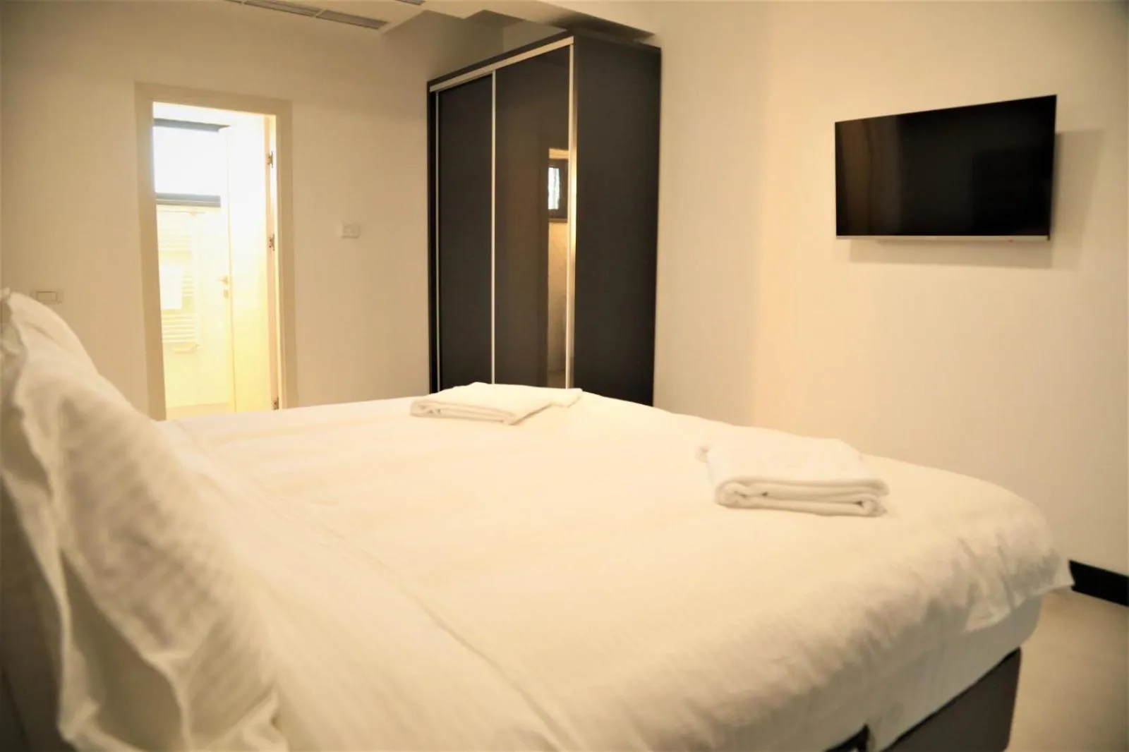 Bed in Enjoy Life Apartments