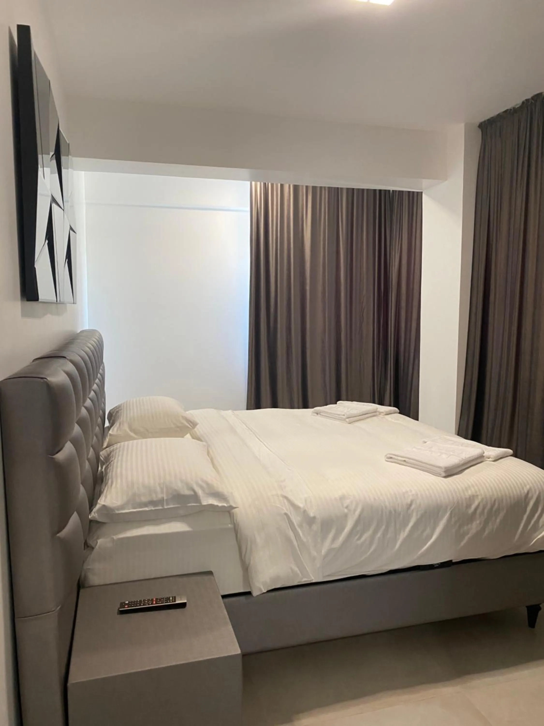 Bed in Enjoy Life Apartments