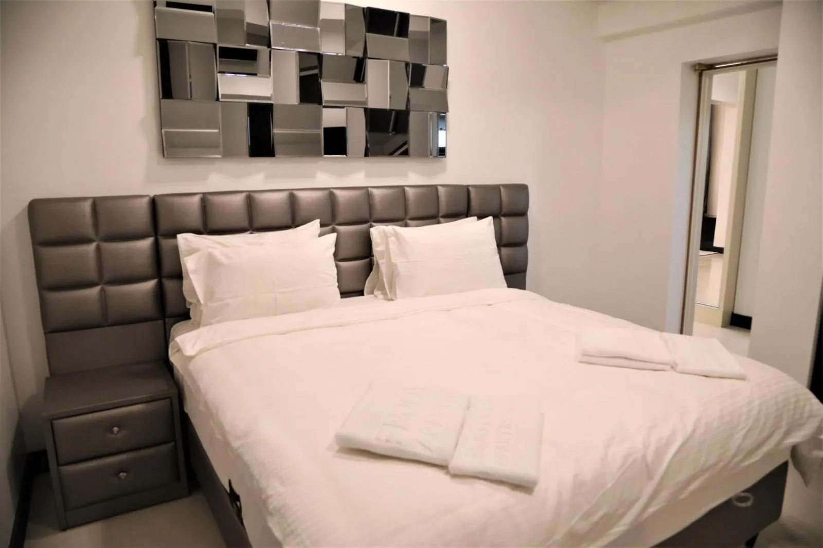 Bed in Enjoy Life Apartments