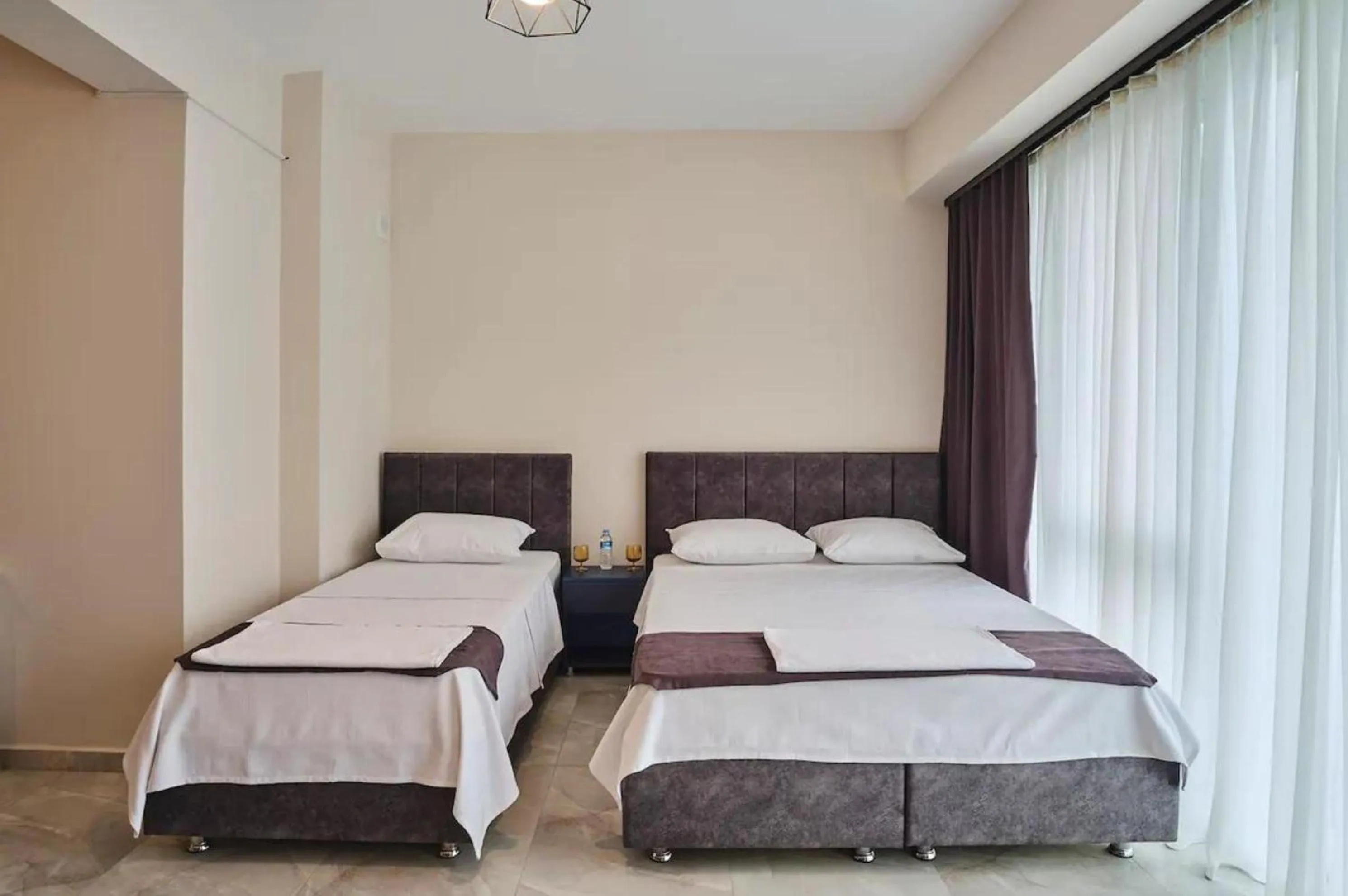 Bed in Mini Suite Otel