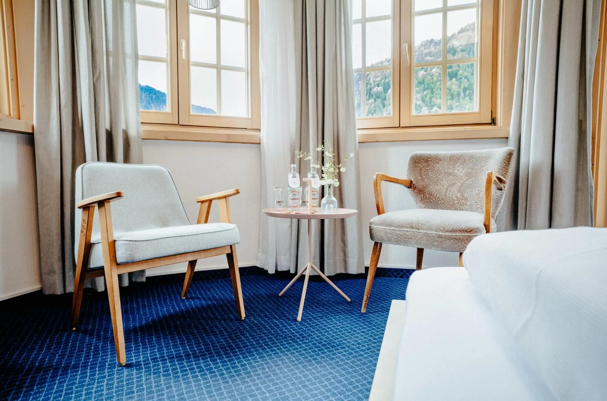 Seating area, Bed in Alpenrose Bayrischzell Hotel