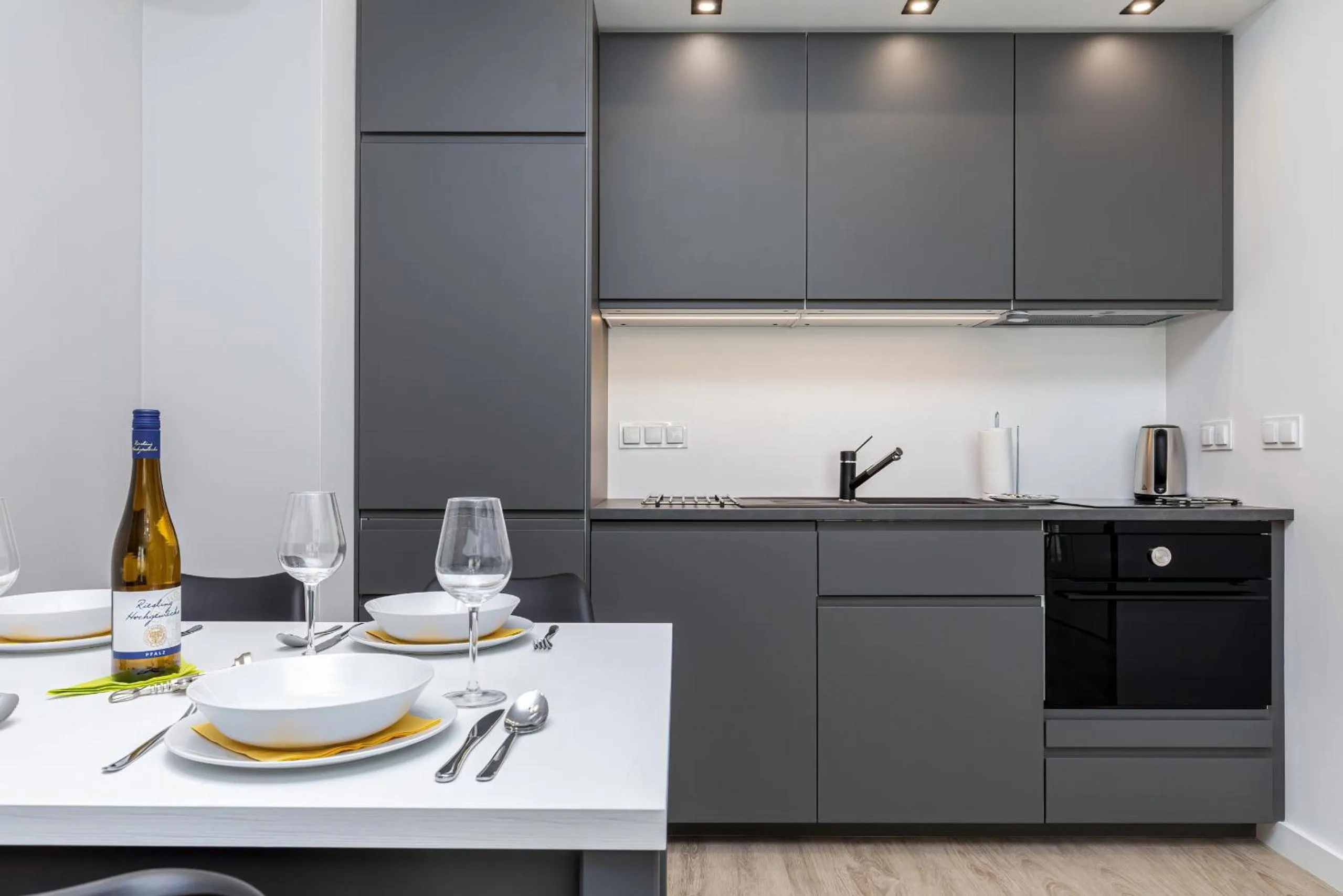 Kitchen or kitchenette in Modern City Center Apartments by Noclegi Renters