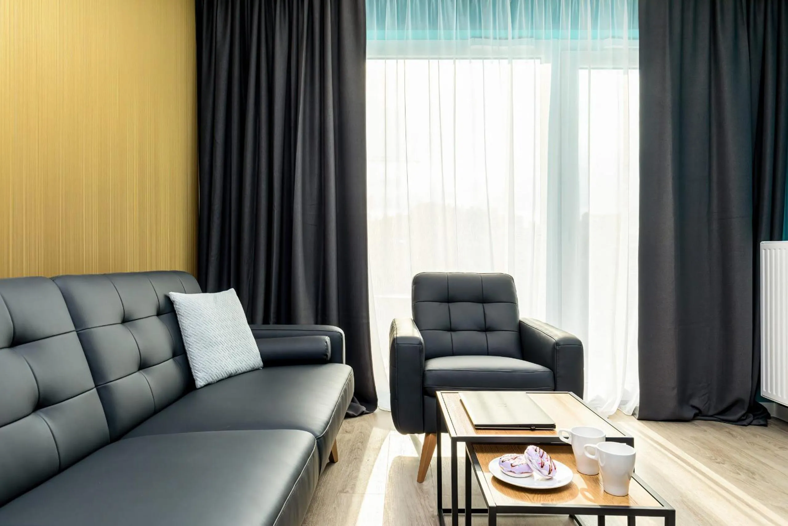Living room in Modern City Center Apartments by Noclegi Renters