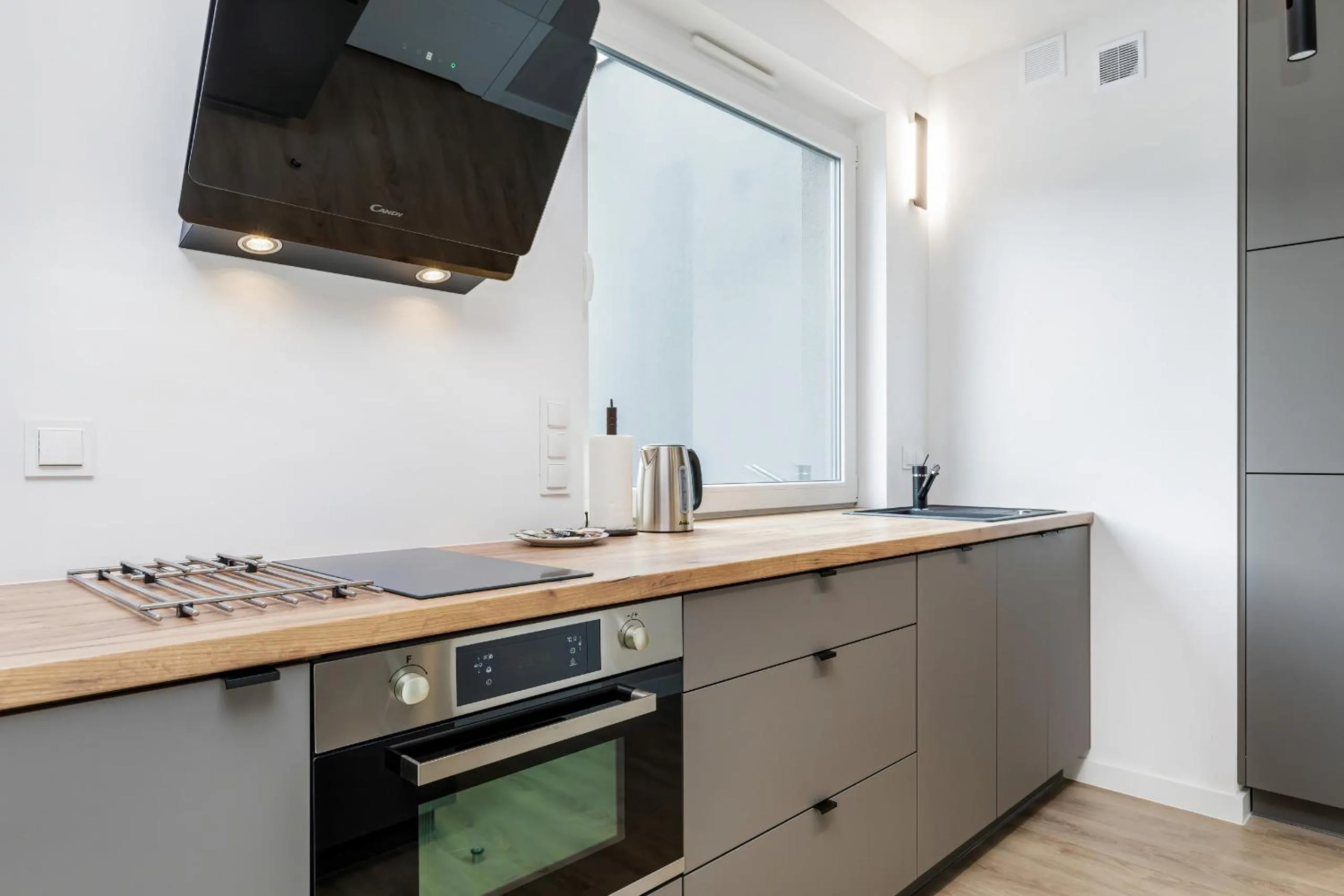 Kitchen or kitchenette in Modern City Center Apartments by Noclegi Renters