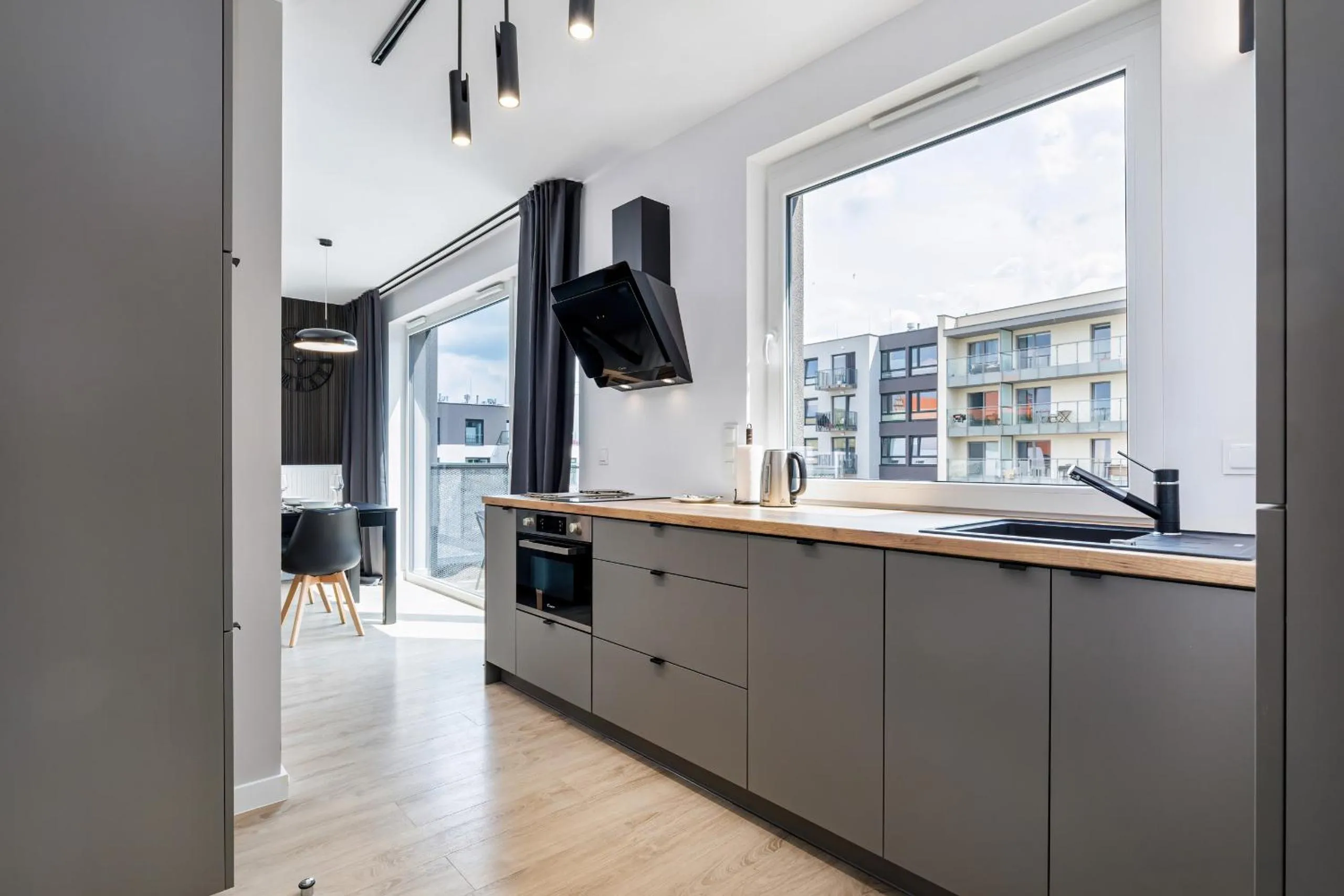 Kitchen or kitchenette in Modern City Center Apartments by Noclegi Renters