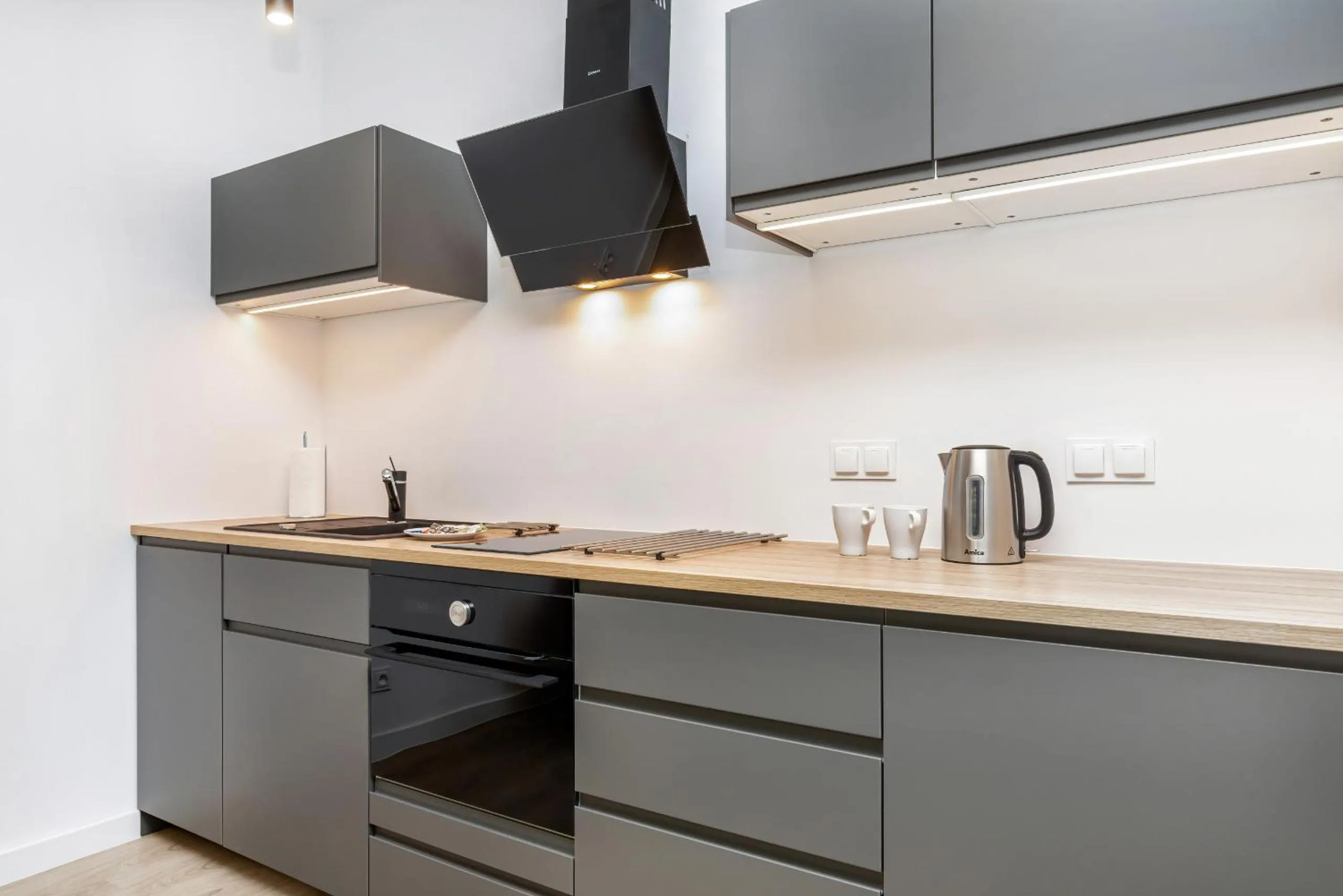 Kitchen or kitchenette in Modern City Center Apartments by Noclegi Renters