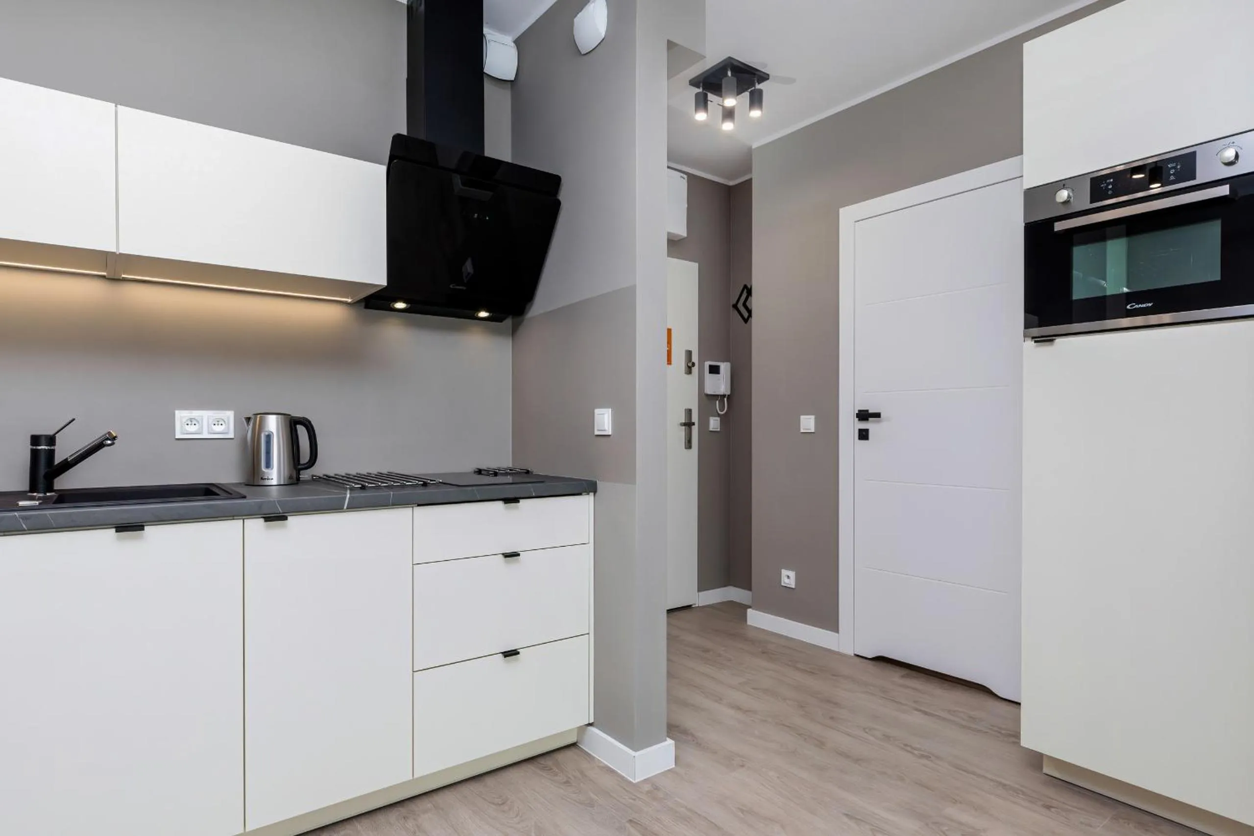 Kitchen or kitchenette in Modern City Center Apartments by Noclegi Renters