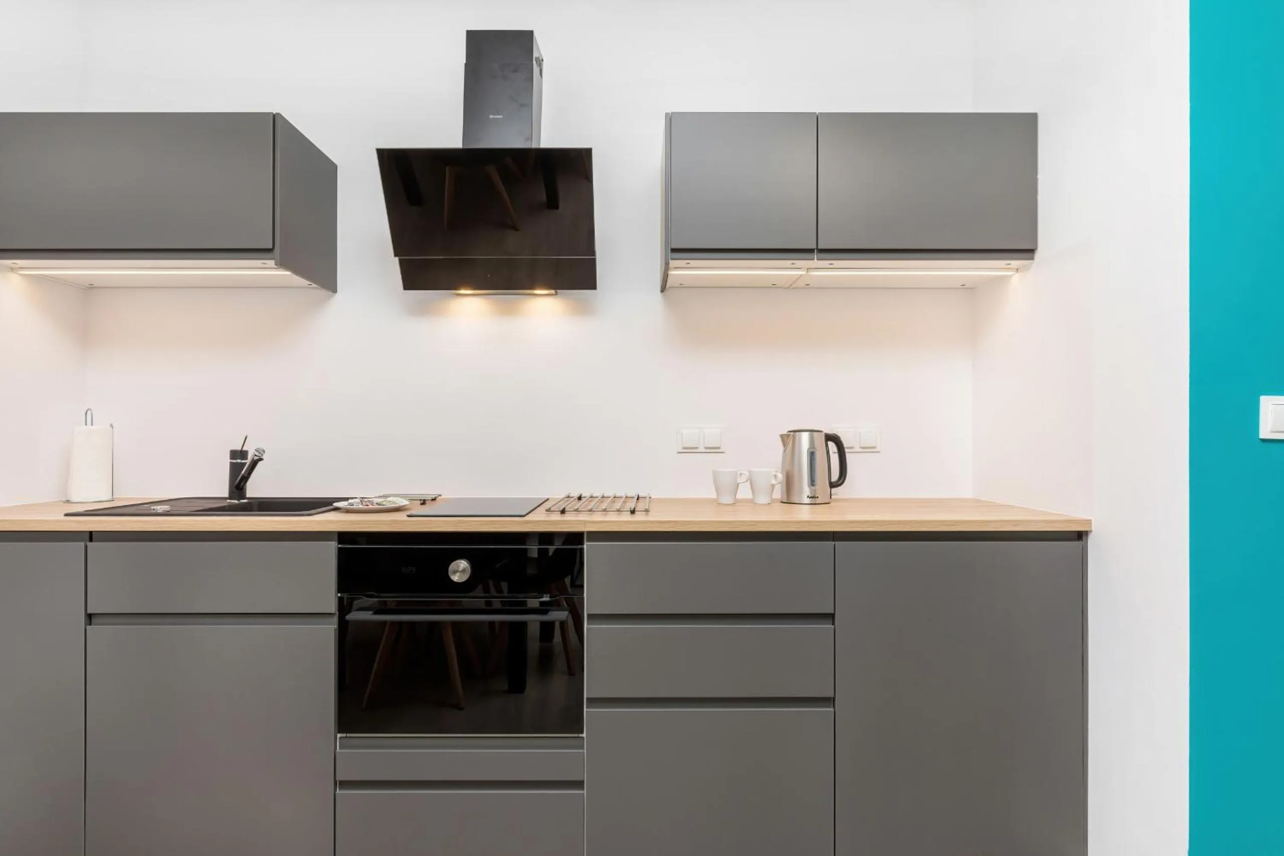 Kitchen or kitchenette in Modern City Center Apartments by Noclegi Renters