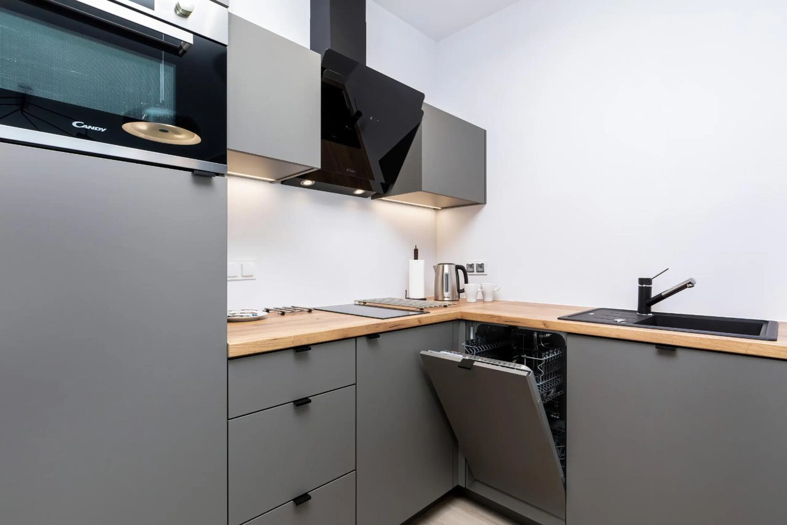 Kitchen or kitchenette in Modern City Center Apartments by Noclegi Renters