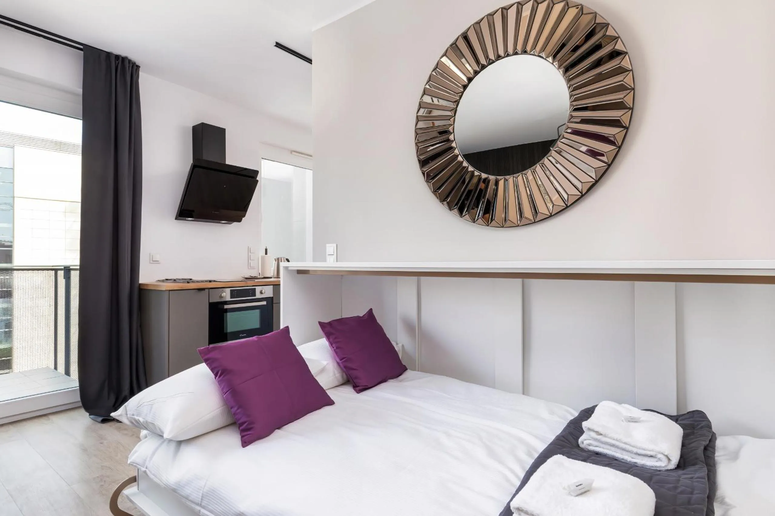 Living room, Bed in Modern City Center Apartments by Noclegi Renters