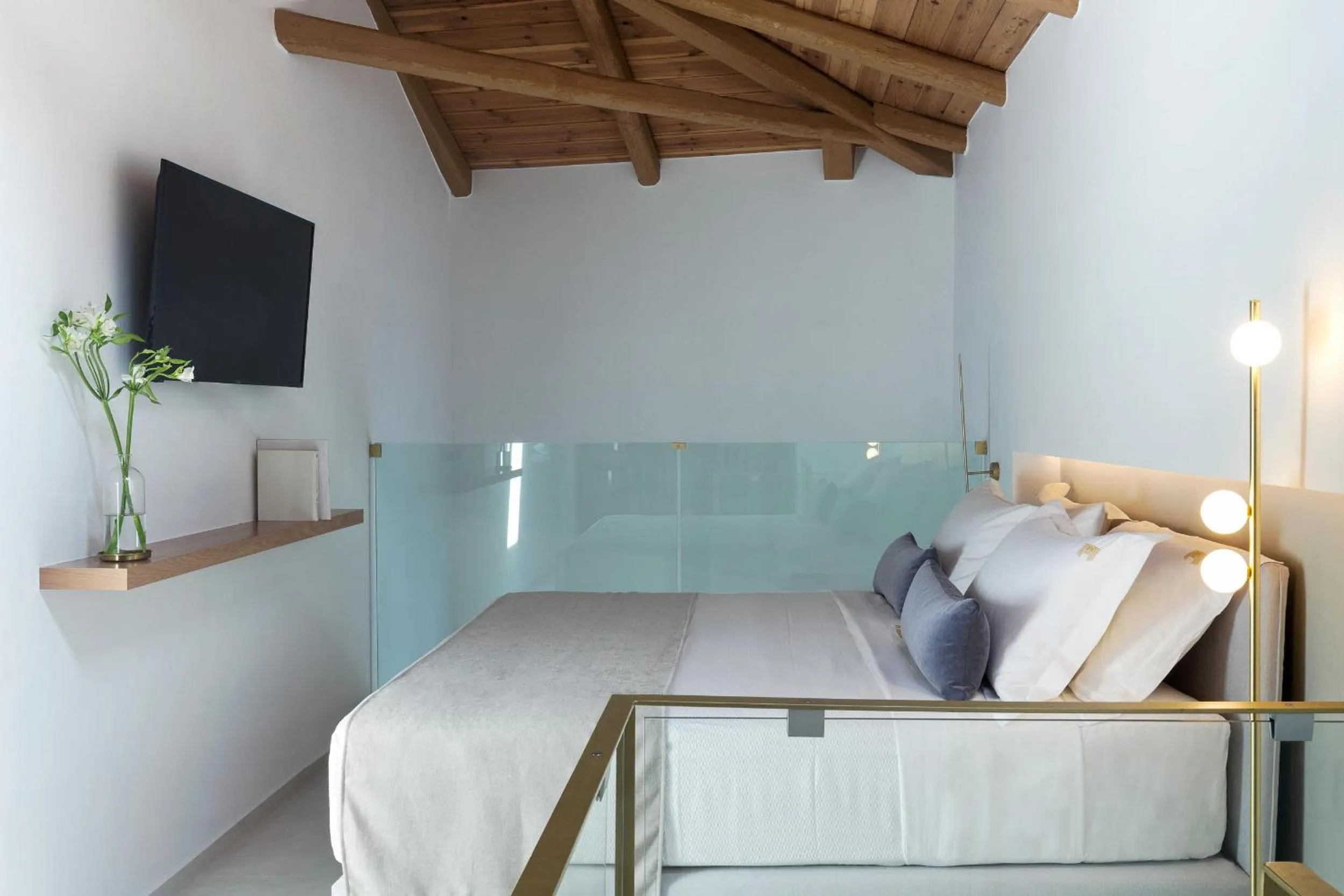 Bed in Mirabile Luxury Suites