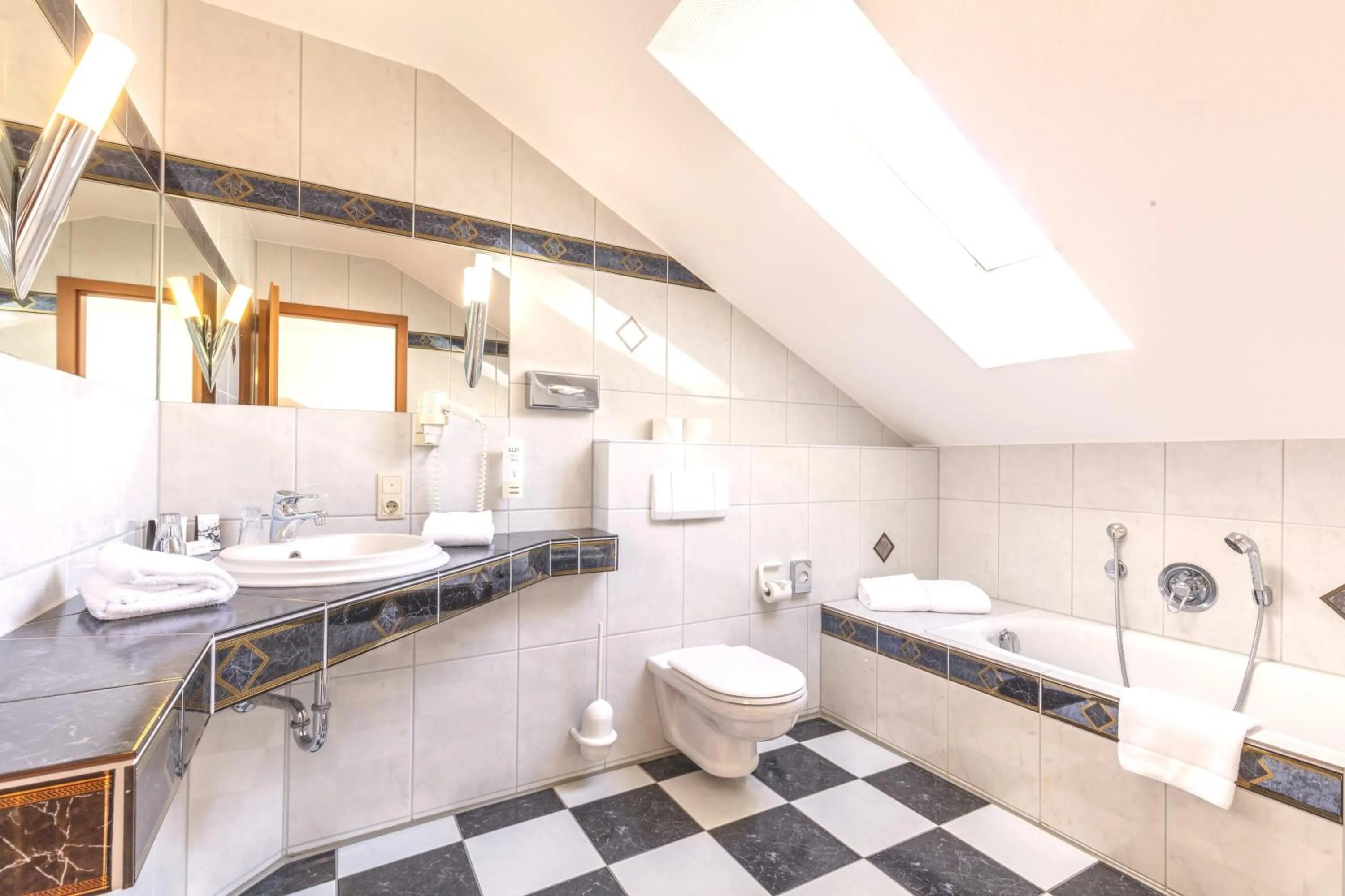 Bathroom in Sport- und Tagungshotel De Poort