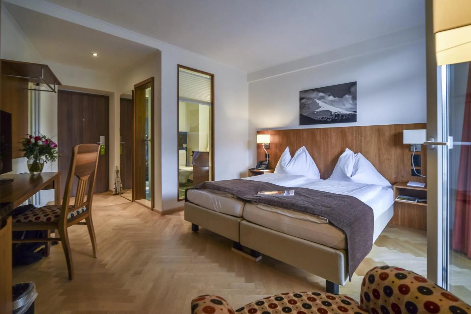 Photo of the whole room, Bed in Waldhotel & SPA Davos - for body & soul