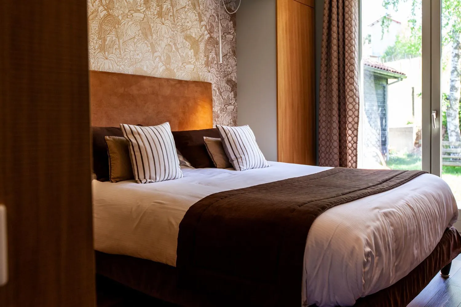 Bed in Logis Hotel Restaurant La Tour