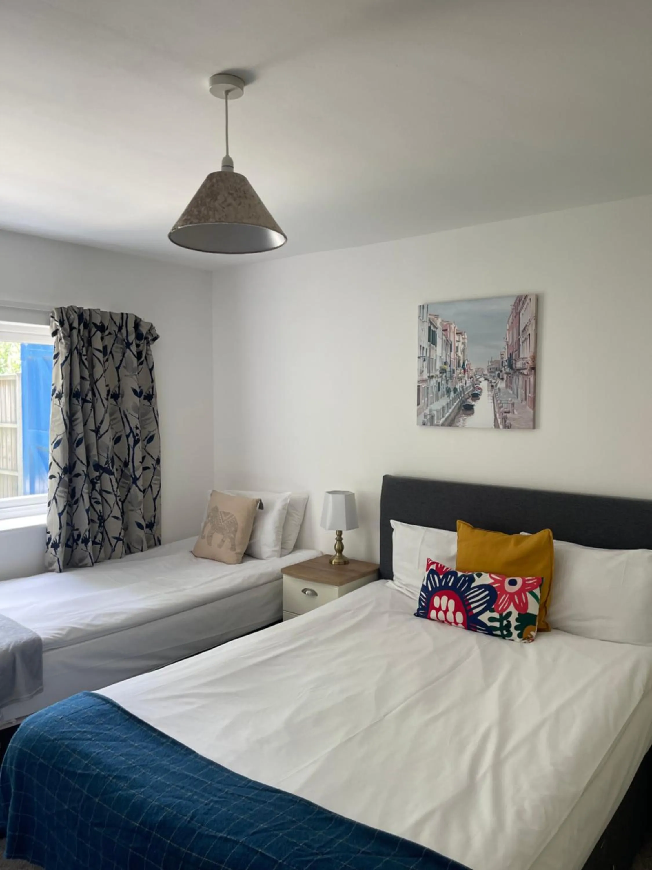 Bed in The Cambridge Suites - Tas Accommodations