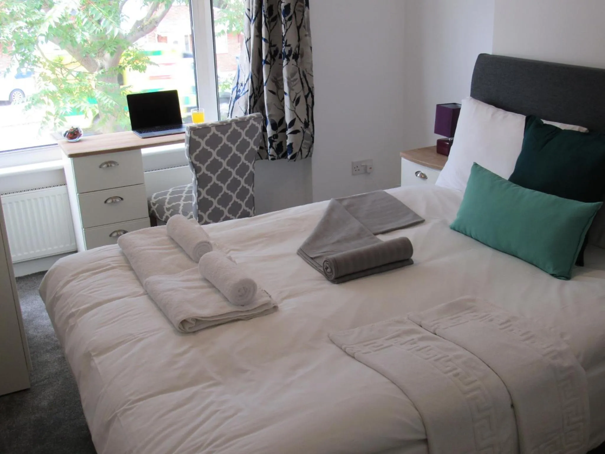 Bed in The Cambridge Suites - Tas Accommodations